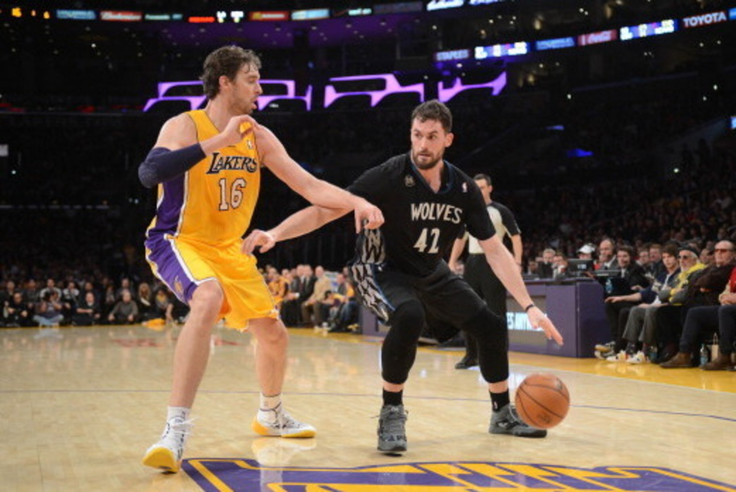 LOS ANGELES, CA - DECEMBER 20: Kevin Love #42 of the Minnesota Timberwolves drives against Pau Gasol #16 of the Los Angeles Lakers at Staples Center on December 20, 2013 in Los Angeles, California. NOTE TO USER: User expressly acknowledges and agrees that