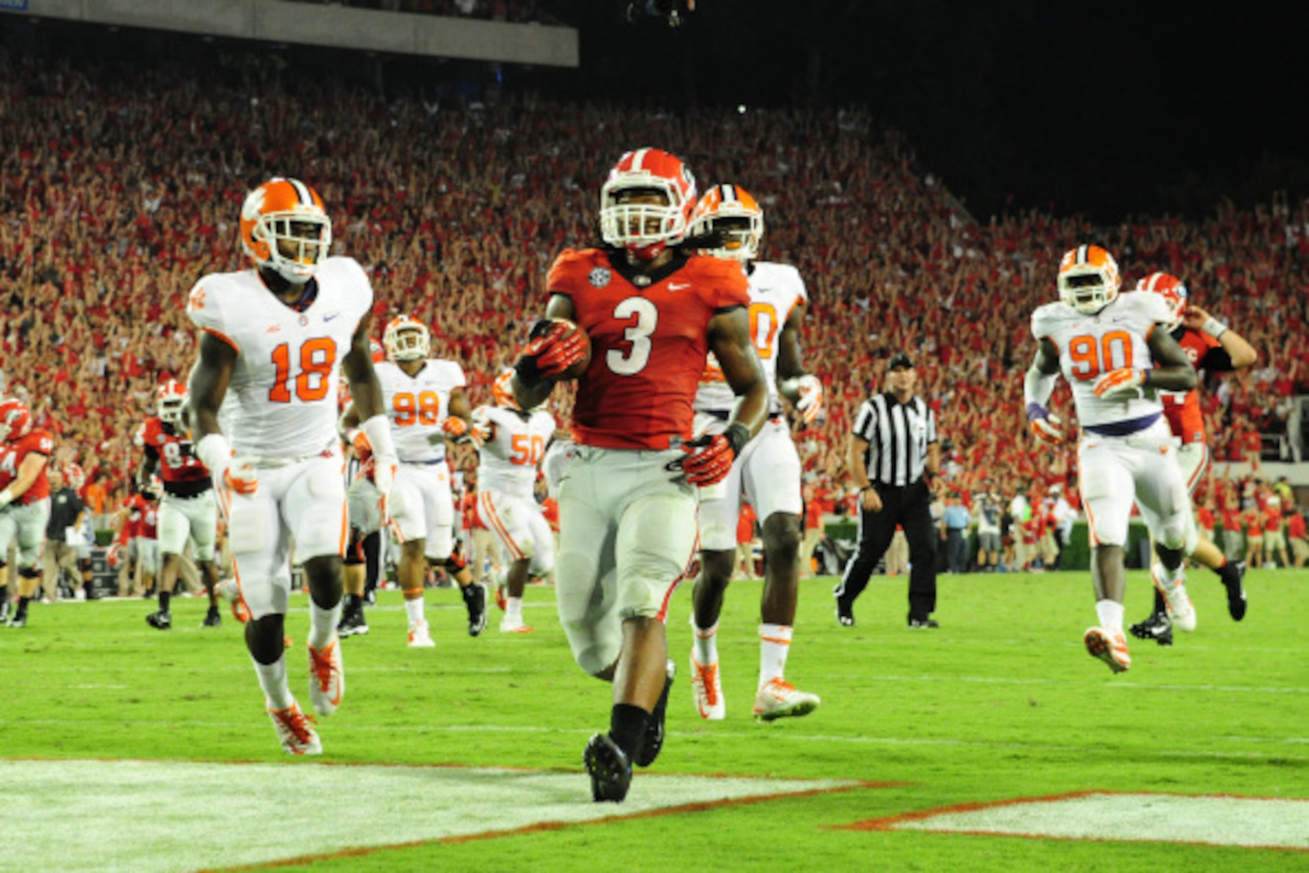 ATHENS, GA - AUGUST 30:  Todd Gurley #3 of the Georgia Bulldogs carries the ball for a fourth-quarter touchdown against the Clemson Tigers at Sanford Stadium on August 30, 2014 in Athens, Georgia. (Photo by Scott Cunningham/Getty Images)