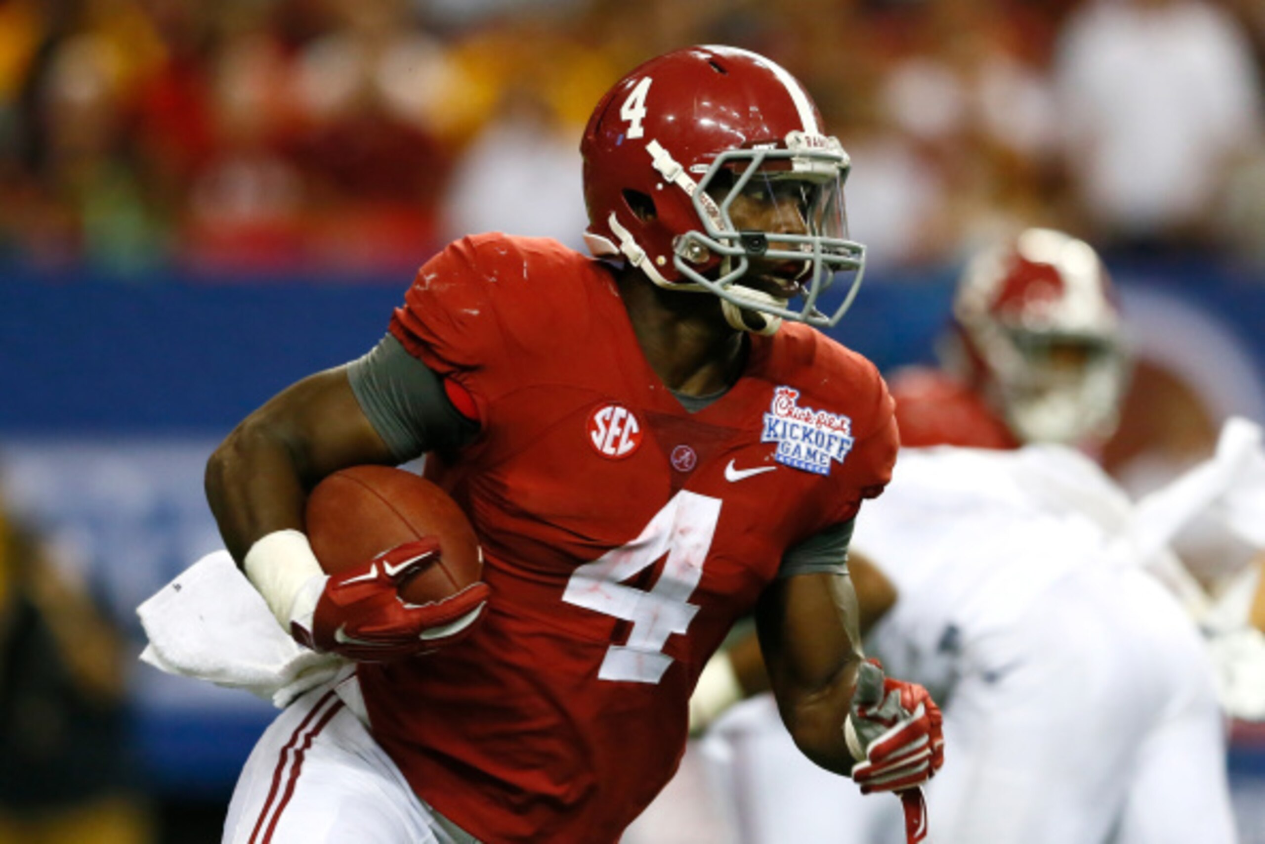 ATLANTA, GA - AUGUST 30:  T.J. Yeldon #4 of the Alabama Crimson Tide rushes upfield against the West Virginia Mountaineers at Georgia Dome on August 30, 2014 in Atlanta, Georgia.  (Photo by Kevin C. Cox/Getty Images)