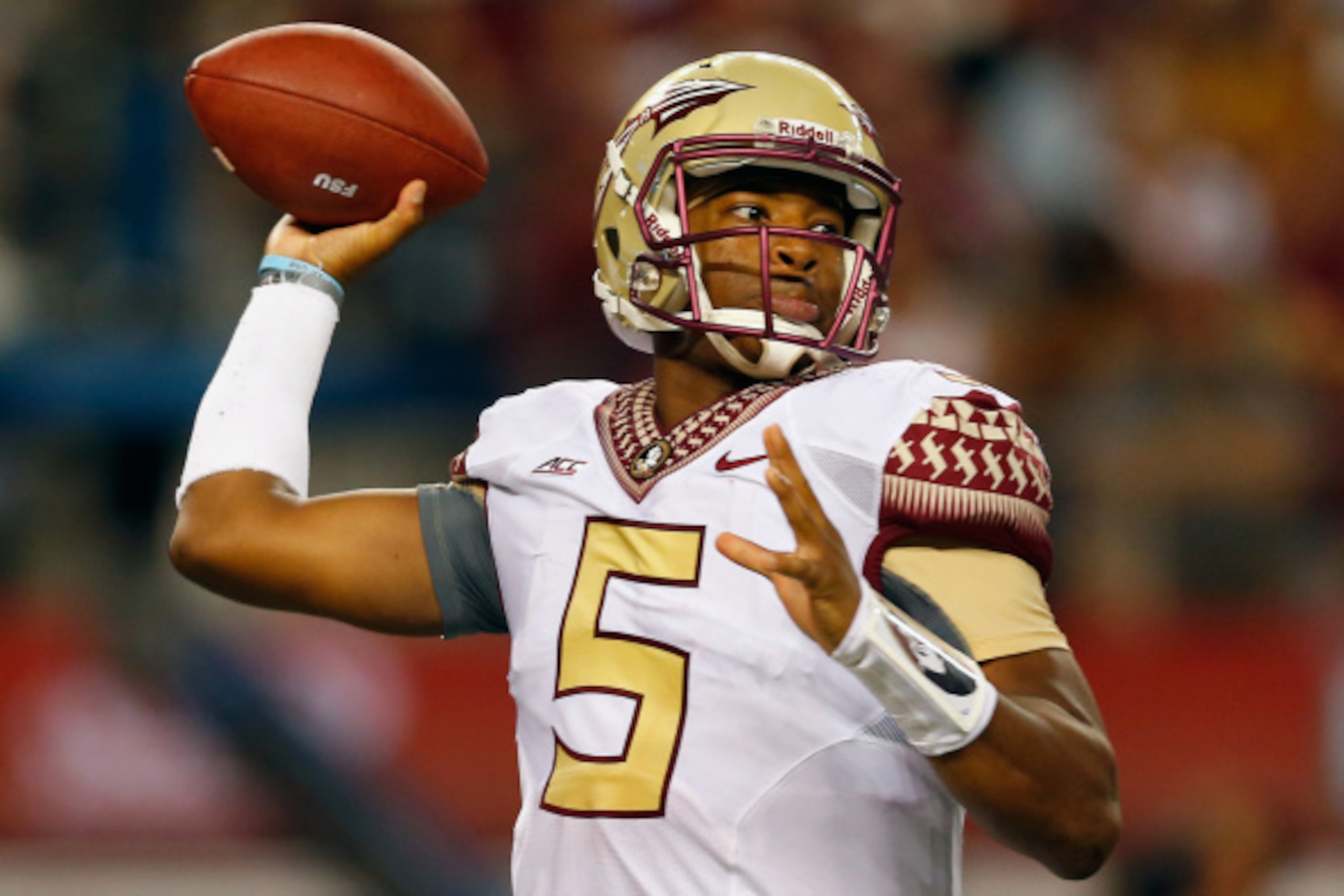 ARLINGTON, TX - AUGUST 30:  Jameis Winston #5 of the Florida State Seminoles passes against the Oklahoma State Cowboys in the first half of the Advocare Cowboys Classic at AT&T Stadium on August 30, 2014 in Arlington, Texas.  (Photo by Tom Pennington/Gett
