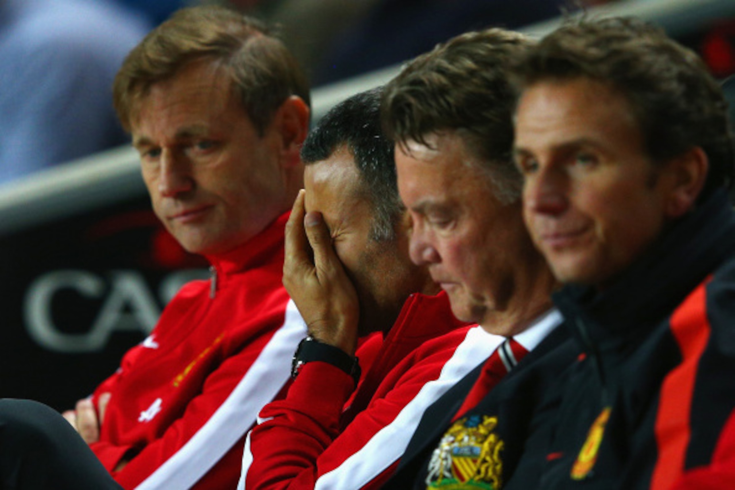 MILTON KEYNES, ENGLAND - AUGUST 26:  Assistant manager Ryan Giggs looks dejected with manager Louis van Gaal of Manchester United during the Capital One Cup Second Round match between MK Dons and Manchester United at Stadium mk on August 26, 2014 in Milto