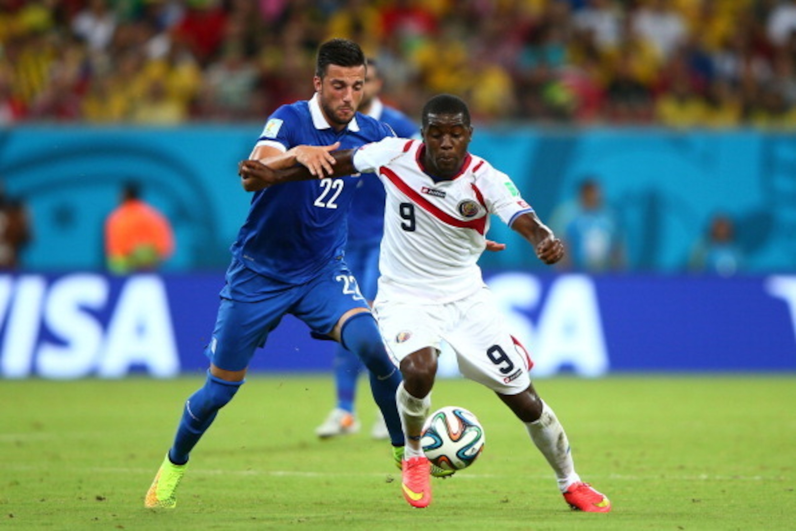 RECIFE, BRAZIL - JUNE 29: Joel Campbell of Costa Rica controls the ball against Andreas Samaris of Greece during the 2014 FIFA World Cup Brazil Round of 16 match between Costa Rica and Greece at Arena Pernambuco on June 29, 2014 in Recife, Brazil.  (Photo