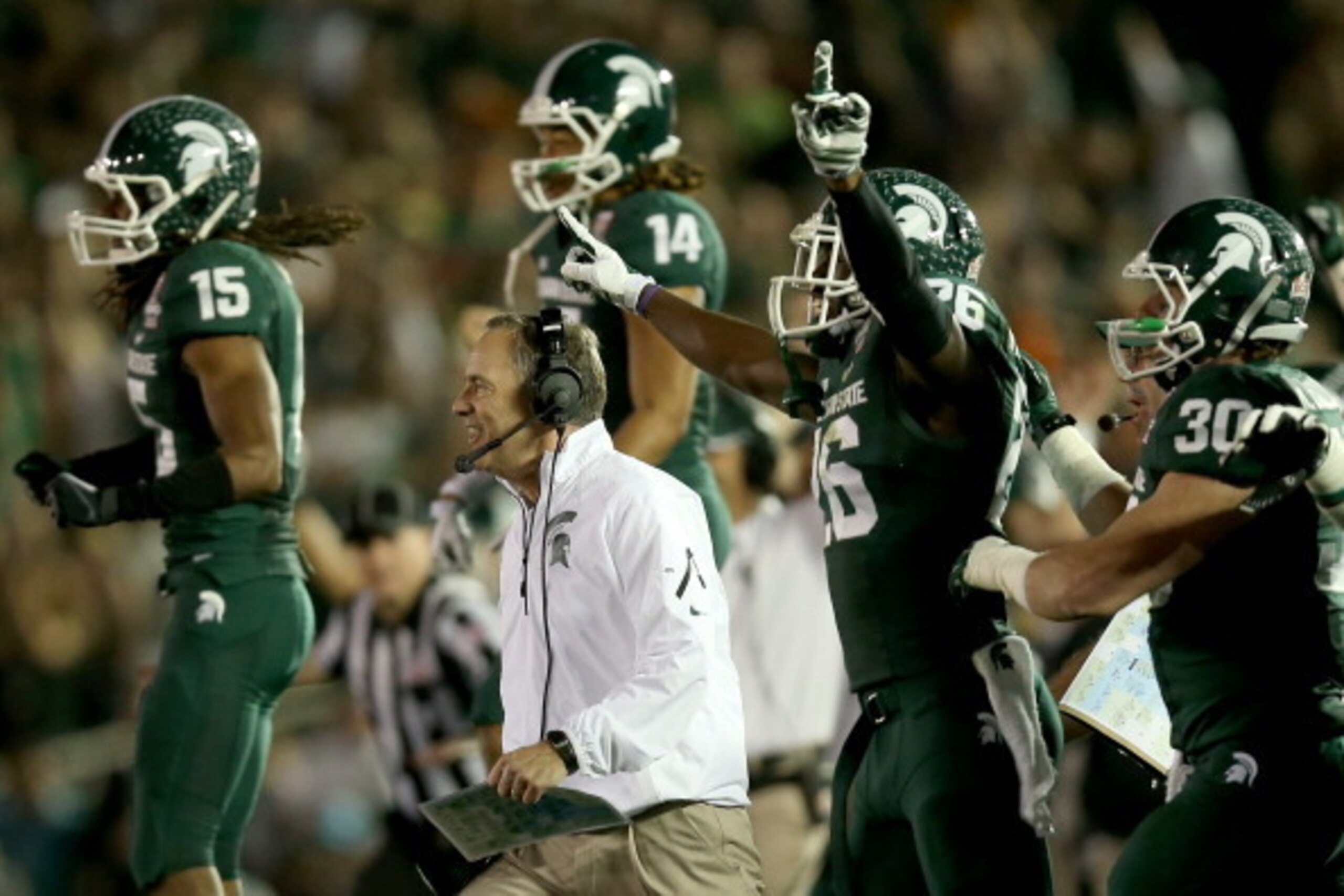 PASADENA, CA - JANUARY 01:  Head coach Mark Dantonio and the Michigan State Spartans celebrate stopping the Stanford Cardinal on fourth down to take possesion in the final moments of their 24-20 win in 100th Rose Bowl Game presented by Vizio at the Rose B