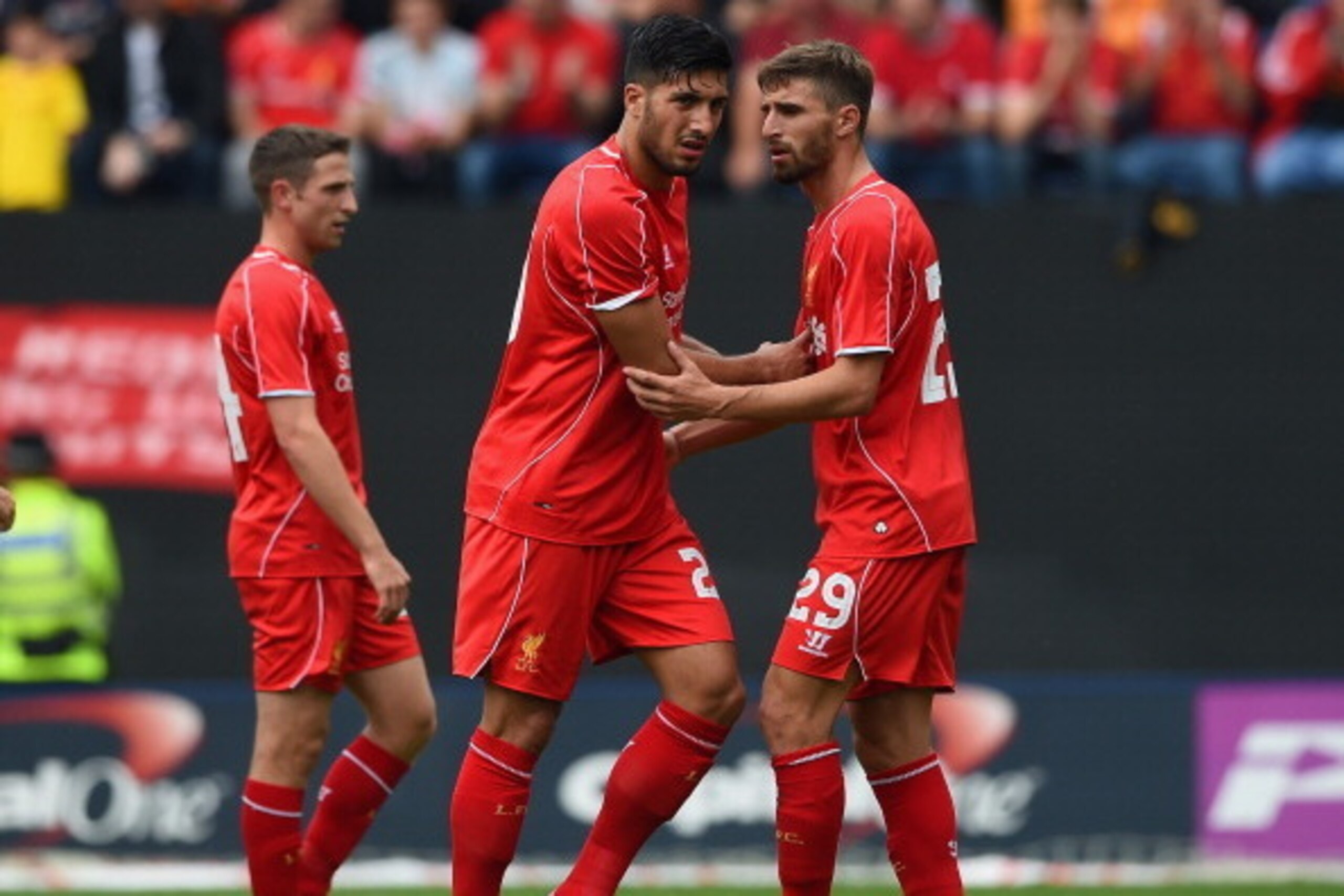 PRESTON, LANCASHIRE - JULY 19: Fabio Borini of Liverpool speaks to team mate Emre Can as he is substituted with an injury during the pre season friendly match between Preston North End and Liverpool at Deepdale on July 19, 2014 in Preston, Lancashire.  (P