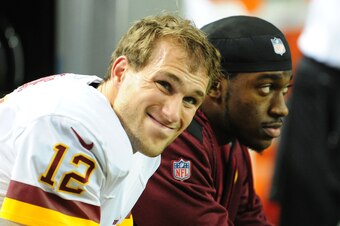 ATLANTA, GA - DECEMBER 15: Kirk Cousins #12 of the Washington Redskins chats with Robert Griffin III after throwing a 4th quarter interception against the Atlanta Falcons at the Georgia Dome on December 15, 2013 in Atlanta, Georgia. (Photo by Scott Cunnin