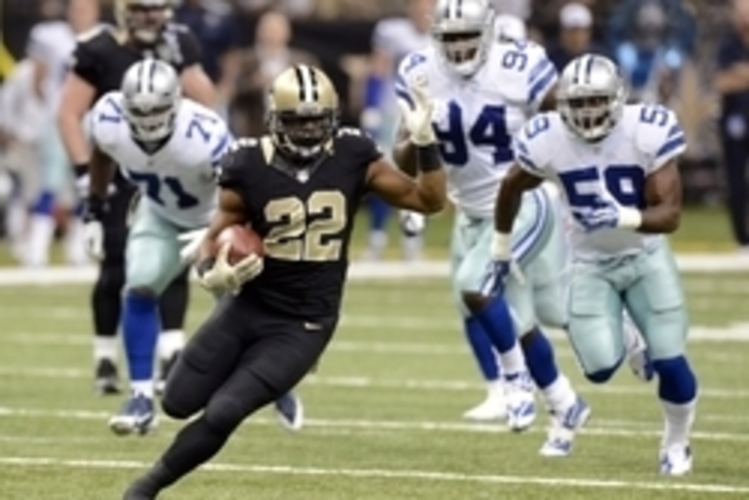 Nov 10, 2013; New Orleans, LA, USA; New Orleans Saints running back Mark Ingram (22) carries the ball up the field against the Dallas Cowboys defense during the second quarter at Mercedes-Benz Superdome. Mandatory Credit: John David Mercer-USA TODAY Sport