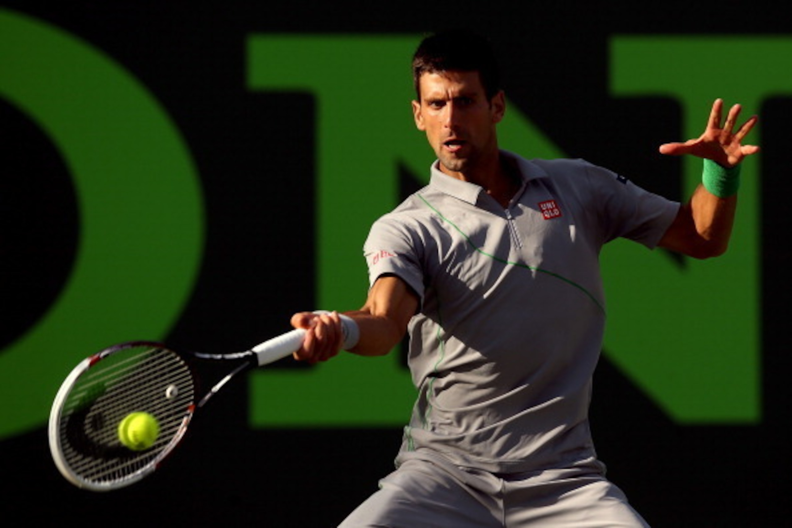 KEY BISCAYNE, FL - MARCH 26: Novak Djokovic of Serbia returns a shot to Andy Murray of Great Britain during the Sony Open at the Crandon Park Tennis Center on March 26, 2014 in Key Biscayne, Florida.  (Photo by Matthew Stockman/Getty Images)