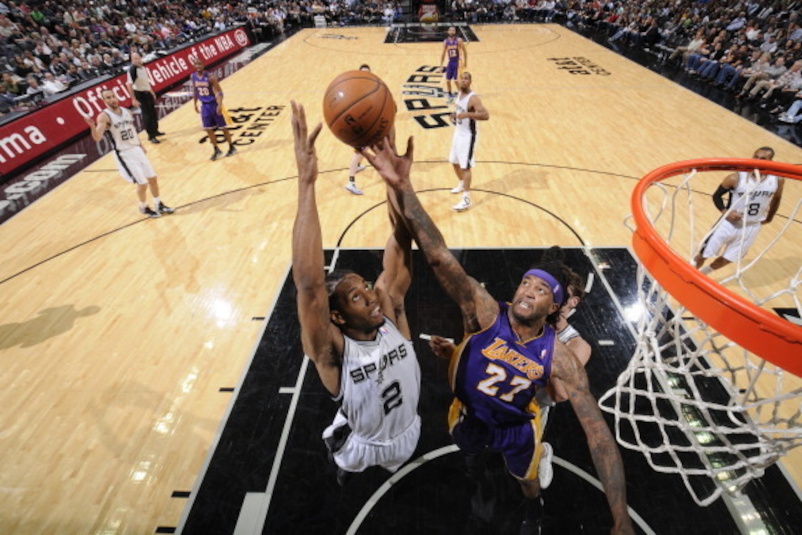 SAN ANTONIO, TX - April 16: Kawhi Leonard #2 of the San Antonio Spurs rebounds against Jordan Hill #27 of the Los Angeles Lakers at the AT&T Center on April 16, 2014 in San Antonio, Texas. NOTE TO USER: User expressly acknowledges and agrees that, by down