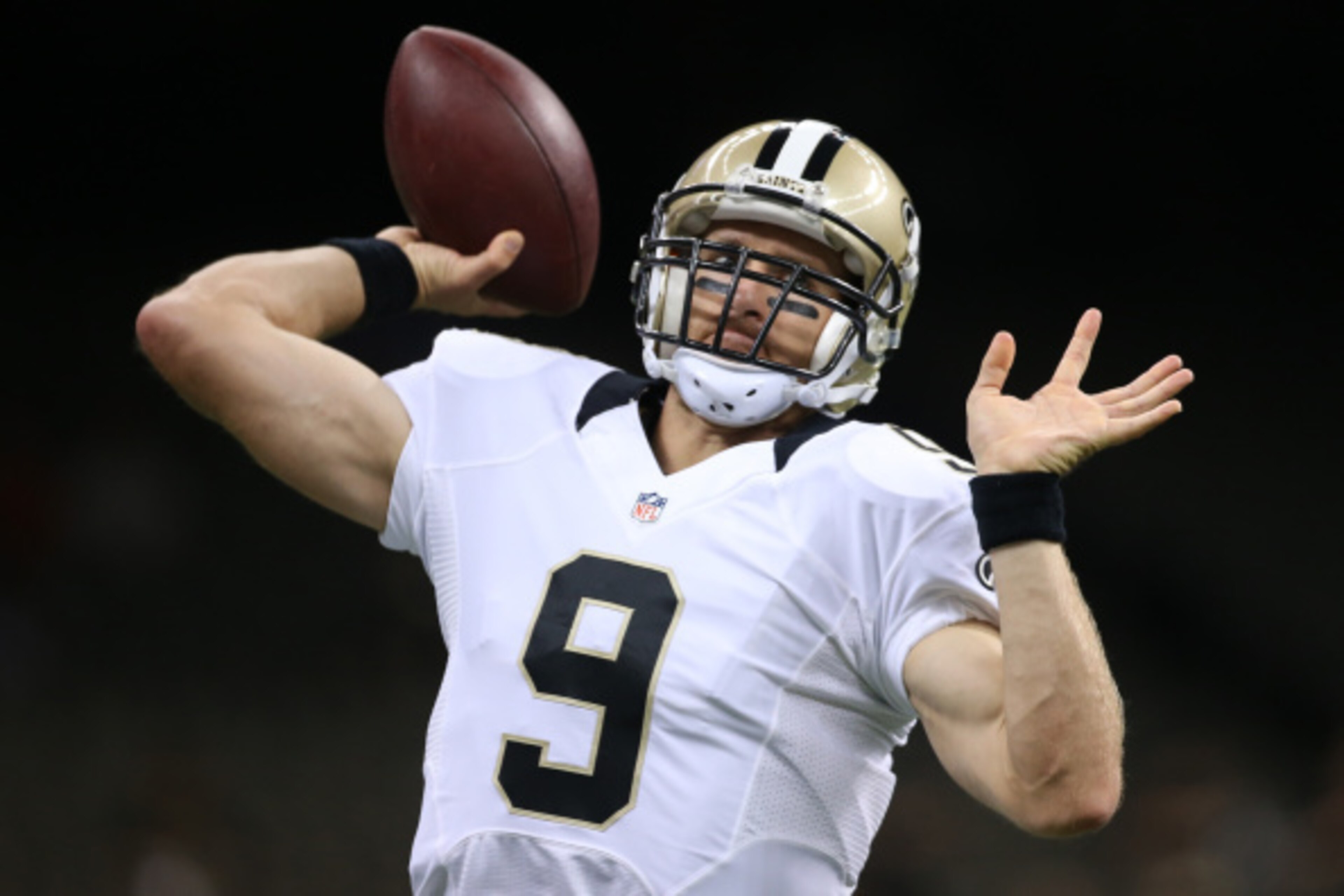 NEW ORLEANS, LA - AUGUST 28:  Drew Brees #9 of the New Orleans Saints warms up before the preseason game against the Baltimore Raven at the Mercedes-Benz Superdome on August 28, 2014 in New Orleans, Louisiana.  (Photo by Chris Graythen/Getty Images)