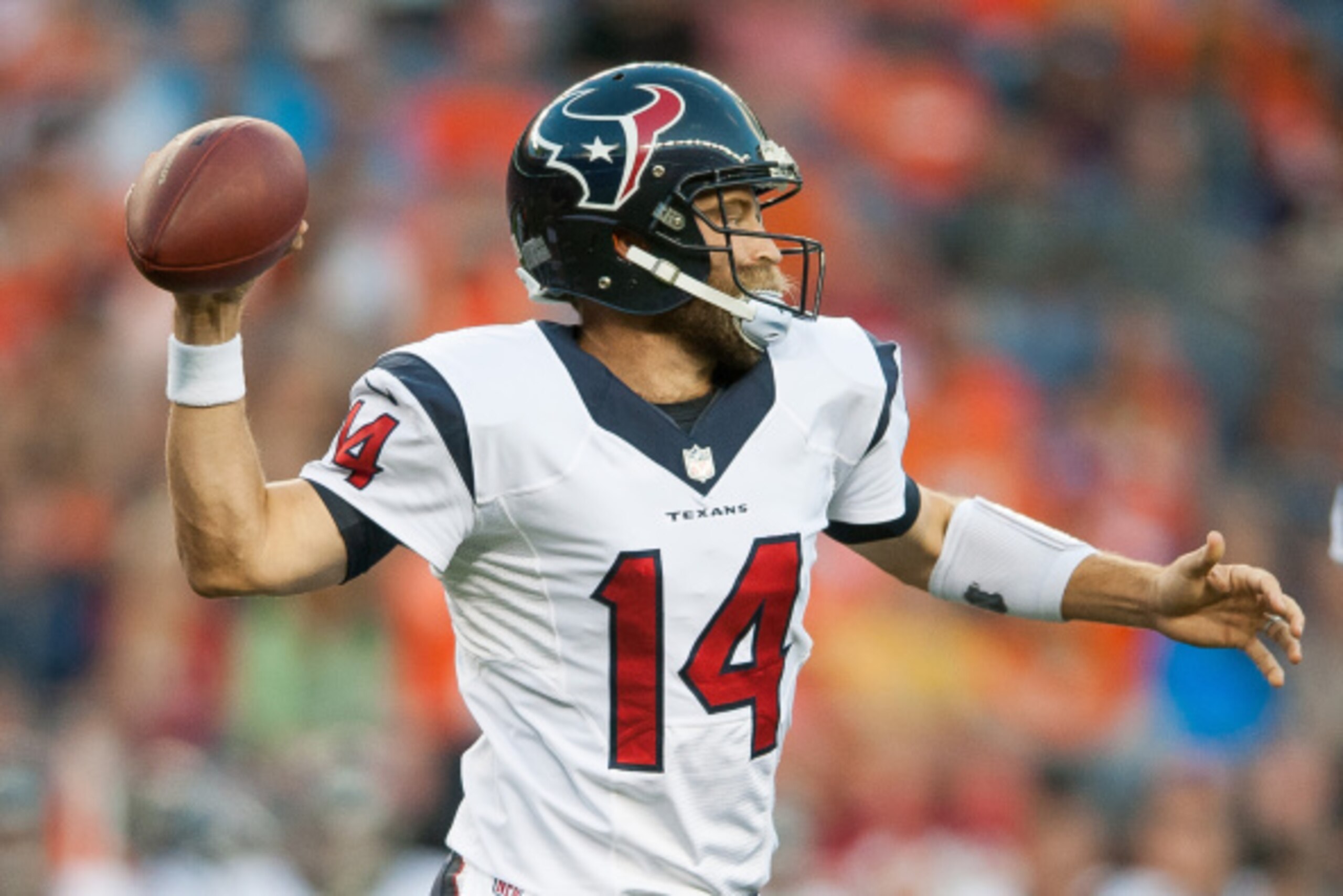 DENVER, CO - AUGUST 23:  Quarterback Ryan Fitzpatrick #14 of the Houston Texans throws against the Denver Broncos during a preseason game at Sports Authority Field at Mile High on August 23, 2014 in Denver, Colorado.  (Photo by Dustin Bradford/Getty Image