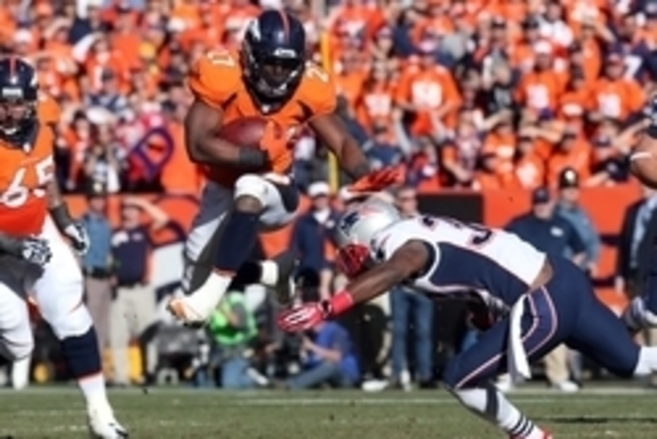 Jan 19, 2014; Denver, CO, USA; Denver Broncos running back Knowshon Moreno (27) rushes the ball against New England Patriots strong safety Duron Harmon (30) during the first half during the 2013 AFC championship playoff football game at Sports Authority F Jan 19, 2014; Denver, CO, USA; Denver Broncos running back Knowshon Moreno (27) rushes the ball against New England Patriots strong safety Duron Harmon (30) during the first half during the 2013 AFC championship playoff football game at Sports Authority F