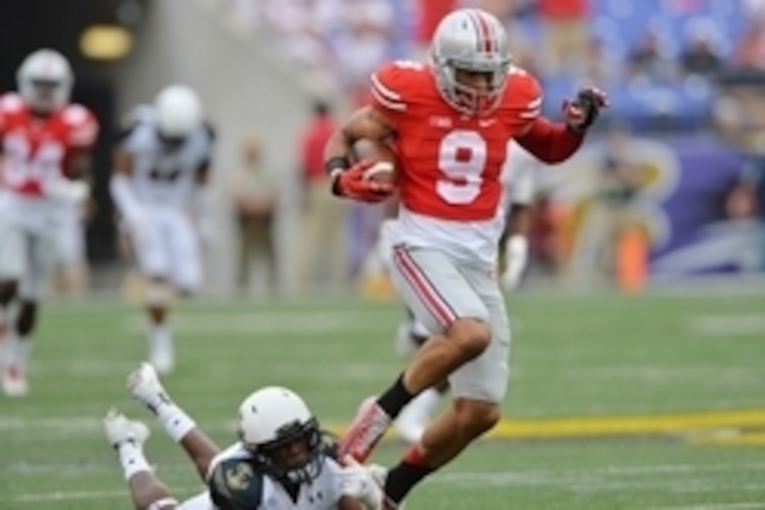 Aug 30, 2014; Baltimore, MD, USA; Ohio State Buckeyes wide receiver Devin Smith (9) runs for a touchdown catching a pass from quarterback J.T. Barrett (16) (not pictured) during the third quarter at M&T Bank Stadium. Ohio State Buckeyes defeated Navy Mids