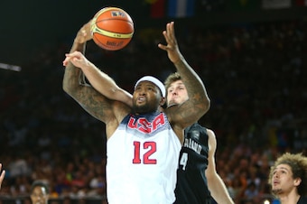 BILBAO, SPAIN - SEPTEMBER 2: DeMarcus Cousins #12 of the USA Basketball Men's National Team rebounds the ball during a game against the New Zealand Basketball Men's National Team during the 2014 FIBA World Cup at Bizkaia Arena in Bilbao Exhibition Centre 