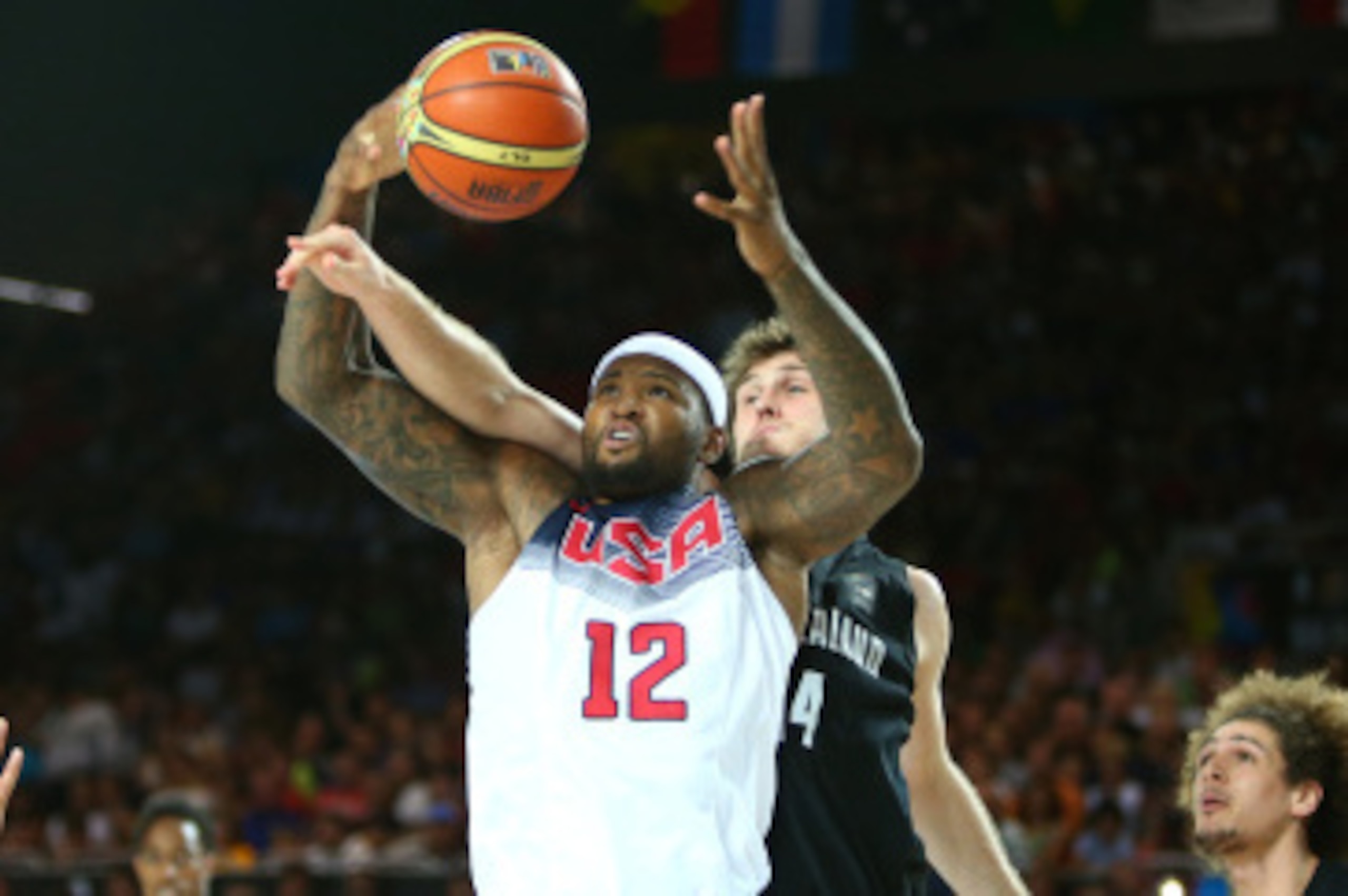 BILBAO, SPAIN - SEPTEMBER 2: DeMarcus Cousins #12 of the USA Basketball Men's National Team rebounds the ball during a game against the New Zealand Basketball Men's National Team during the 2014 FIBA World Cup at Bizkaia Arena in Bilbao Exhibition Centre 