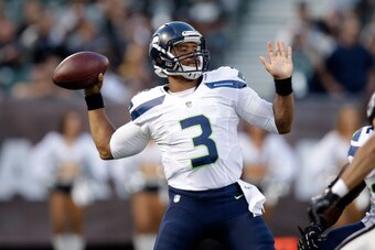 OAKLAND, CA - AUGUST 28:  Quarterback Russell Wilson #3 of the Seattle Seahawks in action against the Oakland Raiders at O.co Coliseum on August 28, 2014 in Oakland, California.  (Photo by Ezra Shaw/Getty Images)