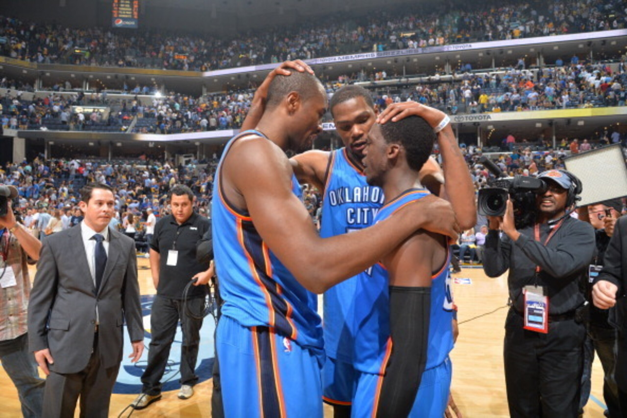 MEMPHIS, TN - APRIL 26: Kevin Durant #35 of the Oklahoma City Thunder hugs his teammate Reggie Jackson #15 against the Memphis Grizzlies Thunder in Game Four of the Western Conference Quarterfinals during the 2014 NBA Playoffs on April 26, 2014 at FedExFo