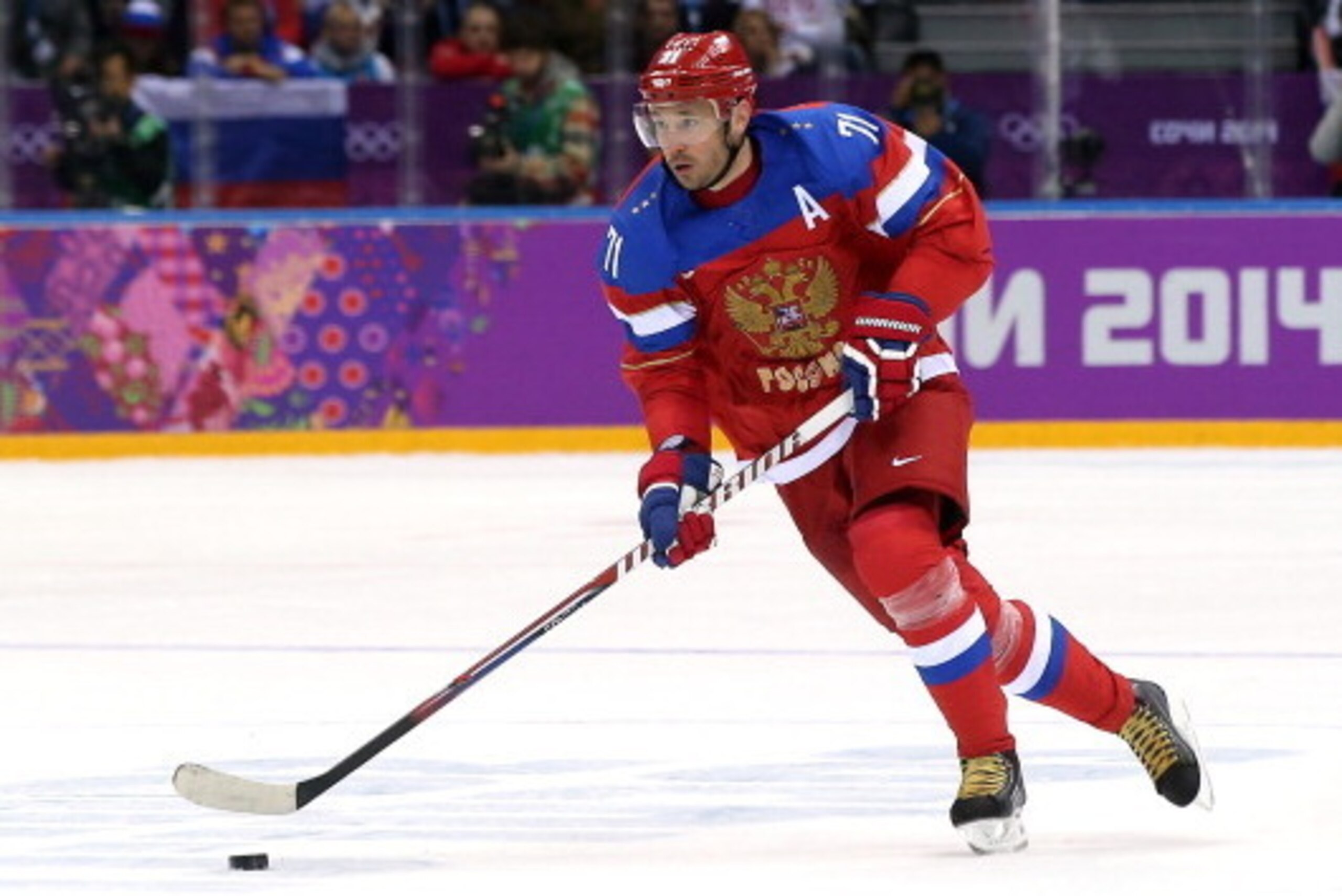 SOCHI, RUSSIA - FEBRUARY 13: Ilya Kovalchuk #71 of Russia handles the puck against Slovenia during the Men's Ice Hockey Preliminary Round Group A game on day six of the Sochi 2014 Winter Olympics at Bolshoy Ice Dome on February 13, 2014 in Sochi, Russia. 