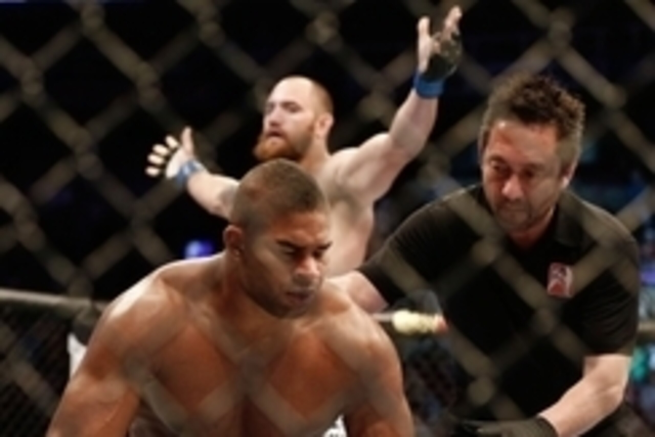 Aug 17, 2013; Boston, MA, USA; Travis Browne, rear, celebrates as  the referee helps up Alistair Overeem during a UFC Heavyweight match at the TD Garden. Brown won by knockout in one round. Mandatory Credit: Winslow Townson-USA TODAY Sports