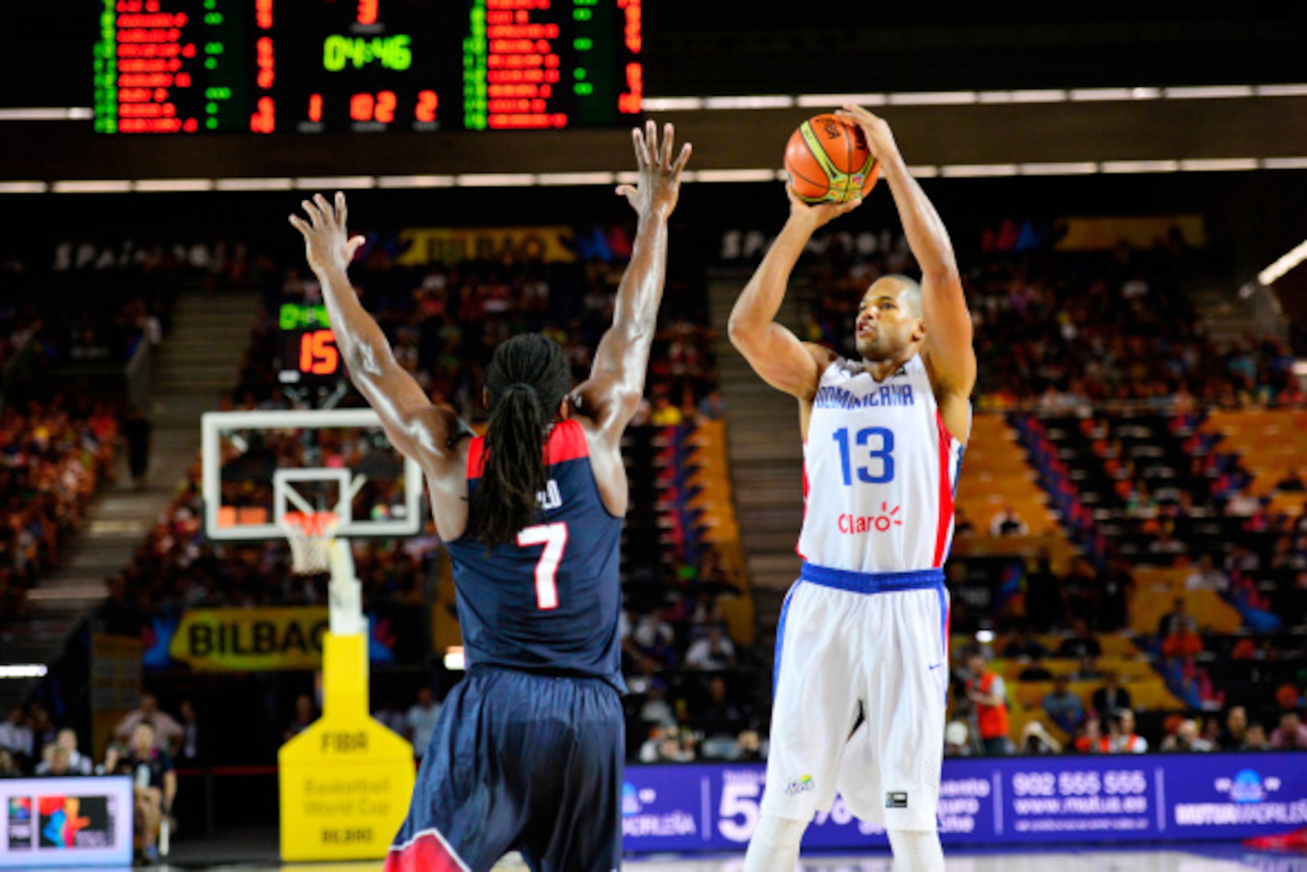BILBAO, SPAIN - SEPTEMBER 3: Eulis Baez #13 of the Dominican Republic Basketball Men's National Team shoots the ball during the game against Kenneth Faried #7 of the USA Basketball Men's National Team during the 2014 FIBA World Cup at Bizkaia Arena in Bil