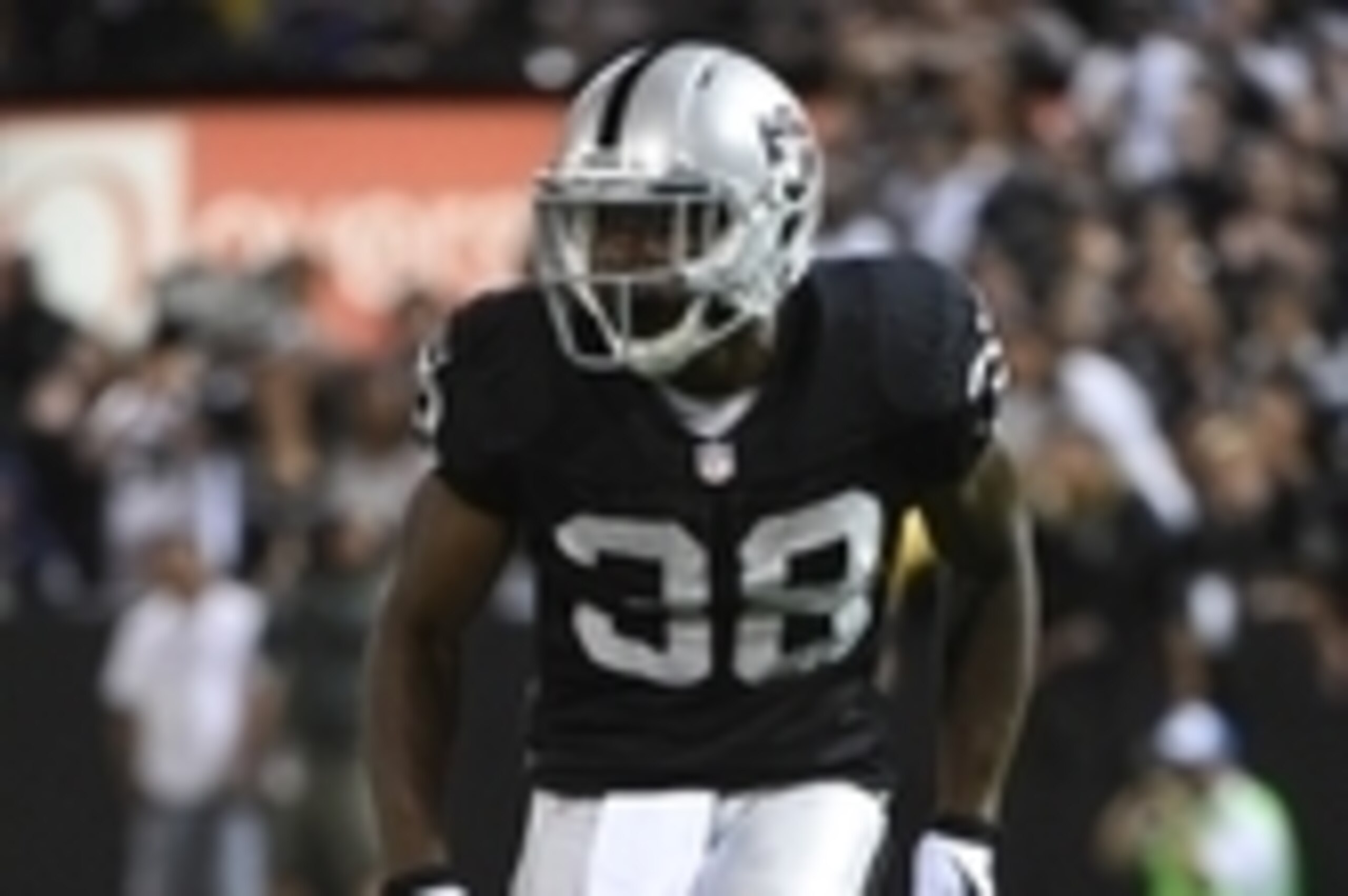 August 15, 2014; Oakland, CA, USA; Oakland Raiders cornerback T.J. Carrie (38) defends during the second quarter against the Detroit Lions at O.co Coliseum. The Raiders defeated the Lions 27-26. Mandatory Credit: Kyle Terada-USA TODAY Sports