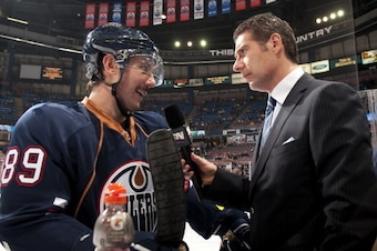 EDMONTON, CANADA - NOVEMBER 28:  Sam Ganger #89 of the Edmonton Oilers is interviewed by Gene Principe of Sportsnet before a game against the Nashville Predators at Rexall Place on November 28, 2011 in Edmonton, Alberta, Canada. (Photo by Andy Devlin/NHLI