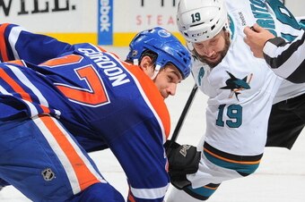 EDMONTON, AB - MARCH 25: Boyd Gordon #27 of the Edmonton Oilers prepares to take a face off against Joe Thornton #19 of the San Jose Sharks on March 25, 2014 at Rexall Place in Edmonton, Alberta, Canada. (Photo by Andy Devlin/NHLI via Getty Images)