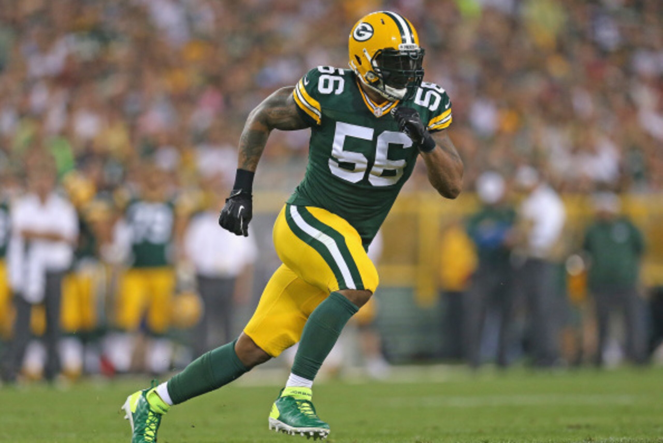 GREEN BAY, WI - AUGUST 22:  Julius Peppers #56 of the Green Bay Packers rushes against the Oakland Raiders during a preseason game at Lambeau Field on August 22, 2014 in Green Bay, Wisconsin. The Packers defeated the Raiders 31-21.  (Photo by Jonathan Dan