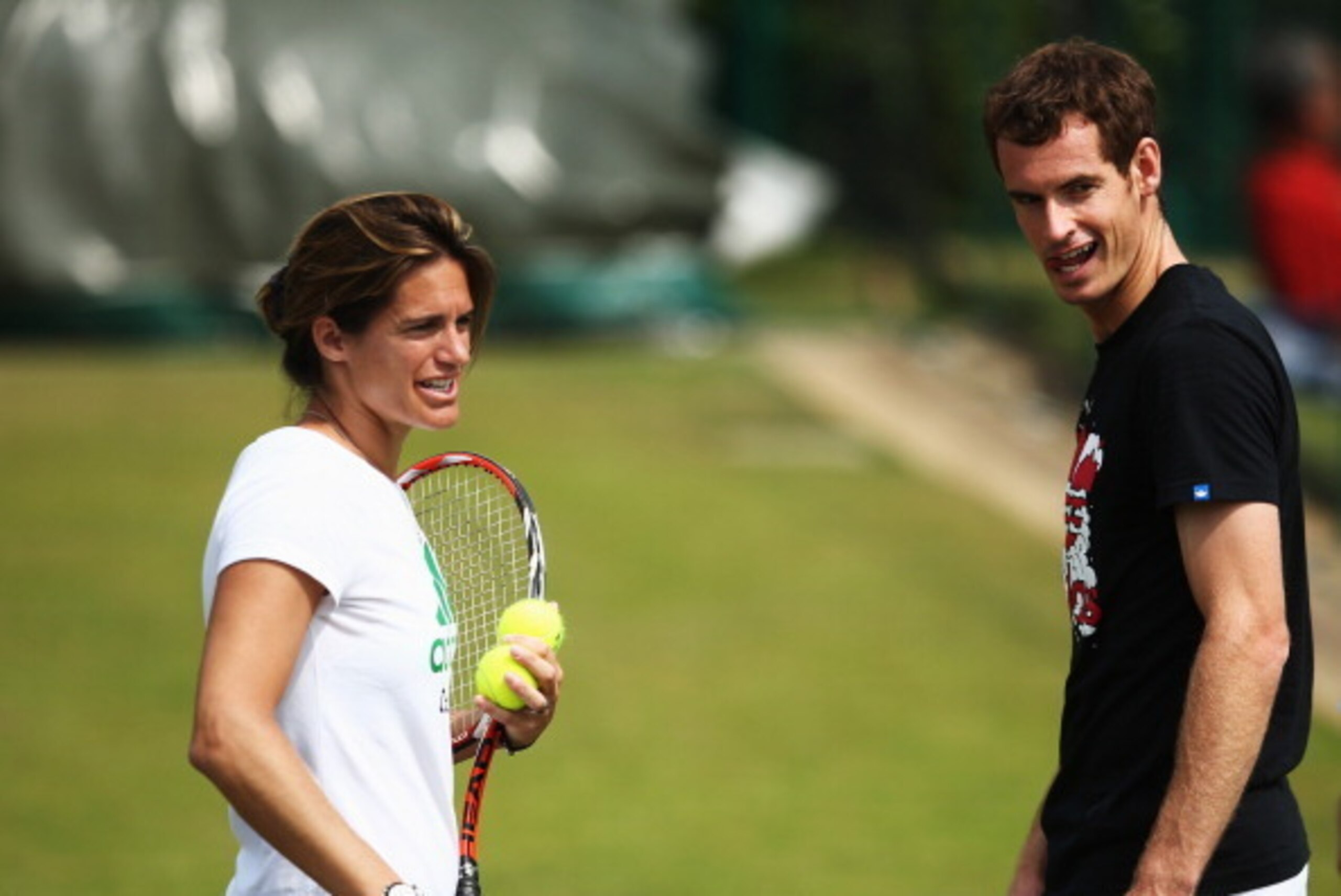 LONDON, ENGLAND - JUNE 24:  Andy Murray of Great Britain talks with coach Amelie Mauresmo during a practice session on day two of the Wimbledon Lawn Tennis Championships at the All England Lawn Tennis and Croquet Club at Wimbledon on June 24, 2014 in Lond