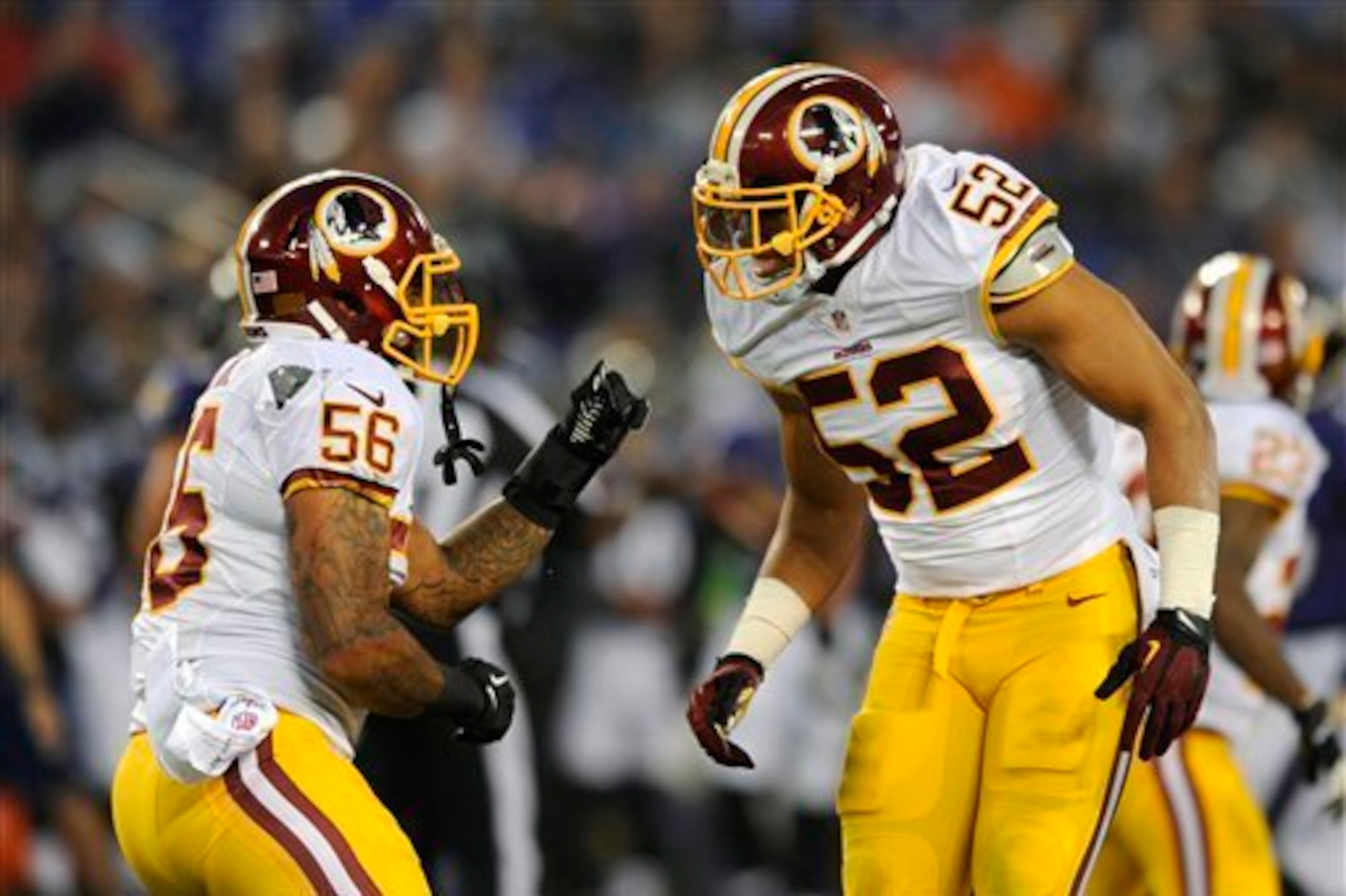 Riley (56) and Robinson must attack downhill against Foster.