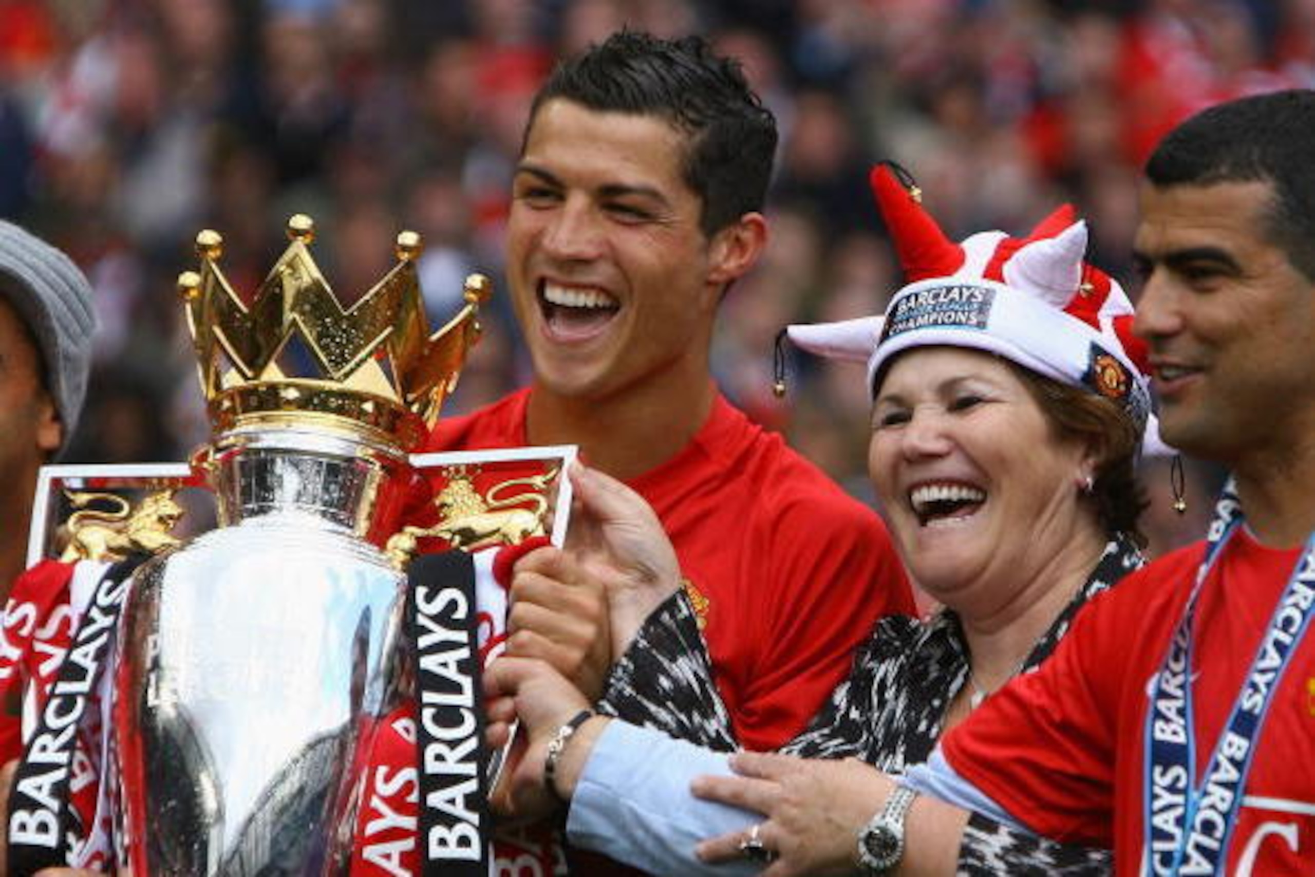 MANCHESTER, ENGLAND - MAY 16:  Cristiano Ronaldo of Manchester United celebrates winning the Barclays Premier League trophy with his mother, Dolores Aveiro after the Barclays Premier League match between Manchester United and Arsenal at Old Trafford on Ma