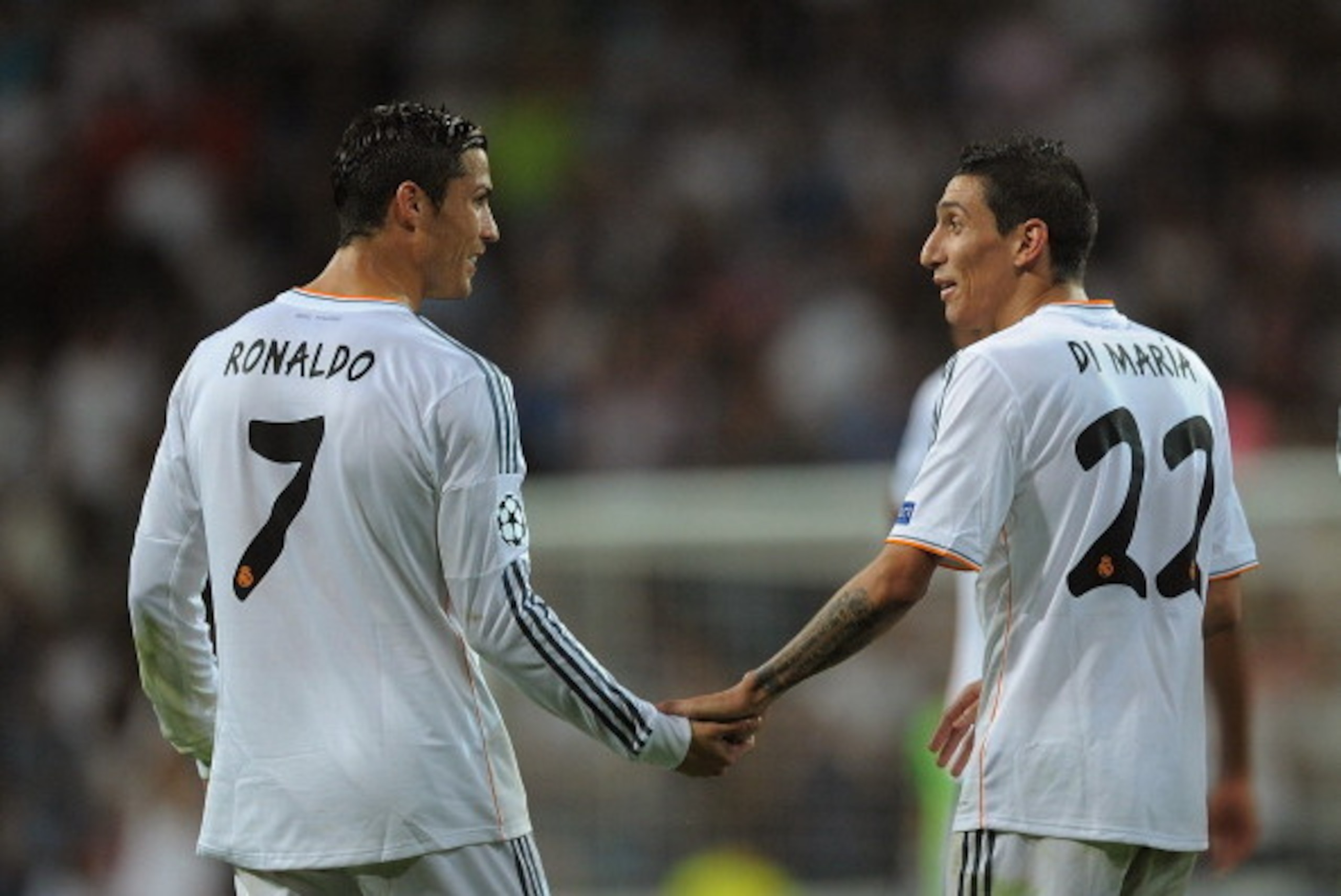 MADRID, SPAIN - OCTOBER 02:   Angel Di Maria (R) of Real Madrid CF celebrates with team-mate Cristiano Ronaldo after scoring their team's third goal during the UEFA Champions League match between Real Madrid CF and FC Copenhagen at Estadio Santiago Bernab