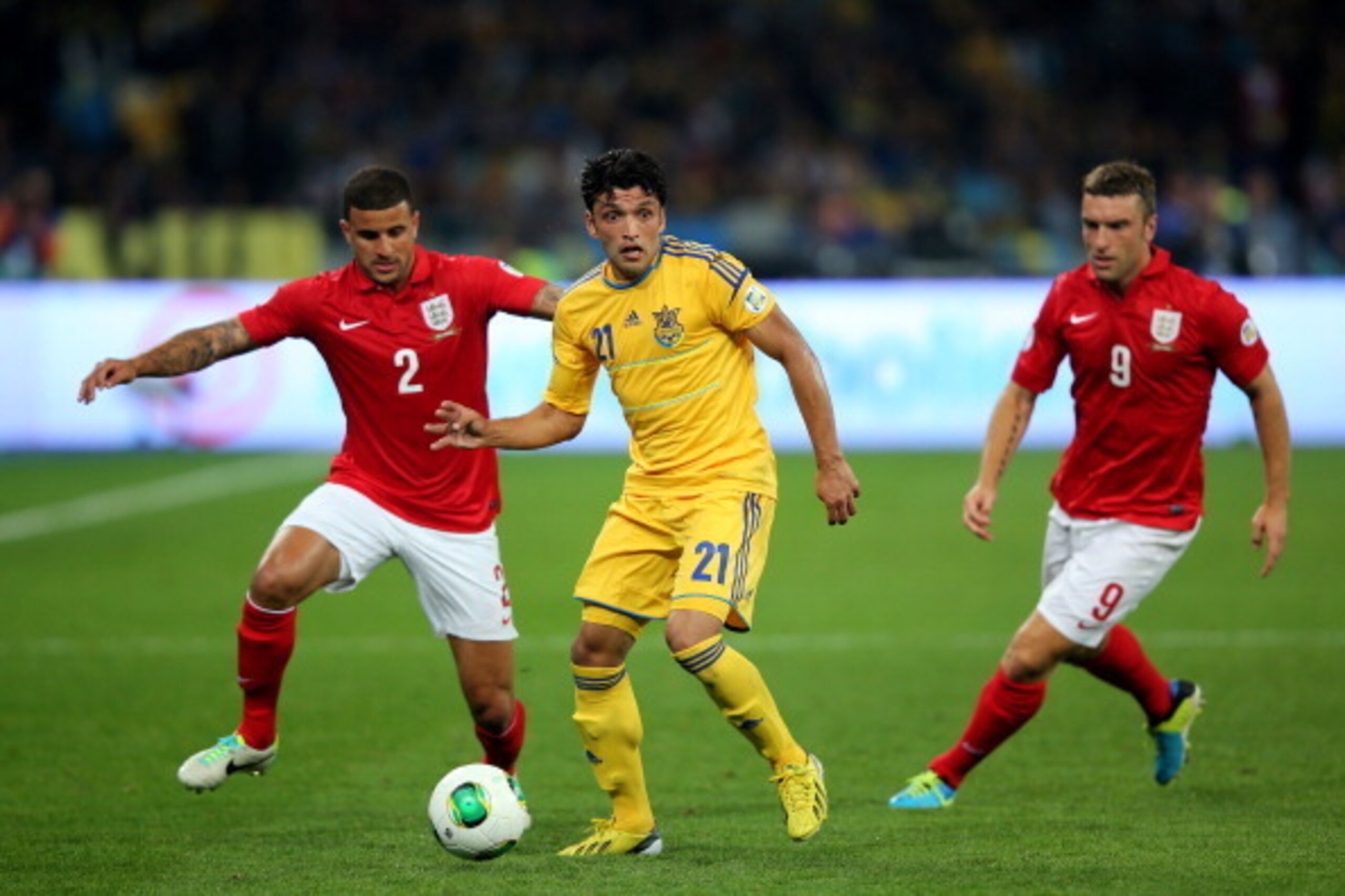 KIEV, UKRAINE - SEPTEMBER 10:  Edmar of Ukraine is pursued by Kyle Walker and Ricky Lambert of England during the FIFA 2014 World Cup Qualifying Group H match between Ukraine and England at the Olympic Stadium on September 10, 2013 in Kiev, Ukraine.  (Pho