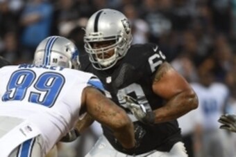 August 15, 2014; Oakland, CA, USA; Oakland Raiders tackle Khalif Barnes (69, right) blocks Detroit Lions defensive tackle C.J. Mosley (99) during the second quarter at O.co Coliseum. The Raiders defeated the Lions 27-26. Mandatory Credit: Kyle Terada-USA 