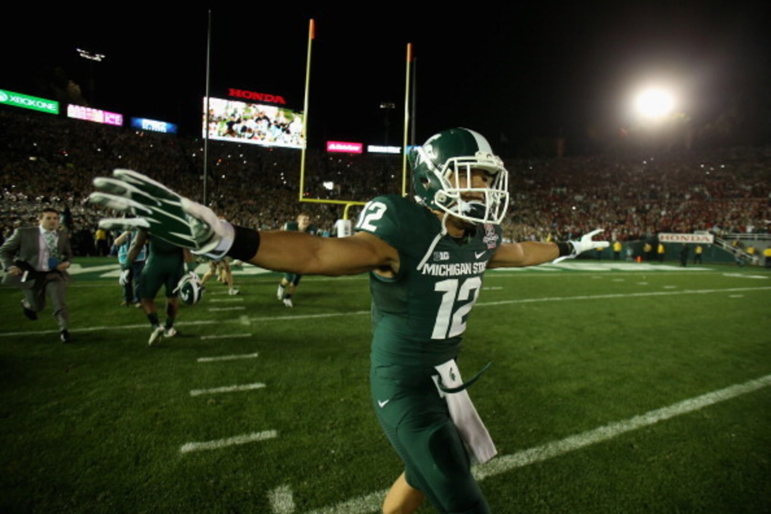 PASADENA, CA - JANUARY 01:  Running back R.J. Shelton #12 of the Michigan State Spartans celebrates following their 24-20 win over the Stanford Cardinal in the 100th Rose Bowl Game presented by Vizio at the Rose Bowl on January 1, 2014 in Pasadena, Califo