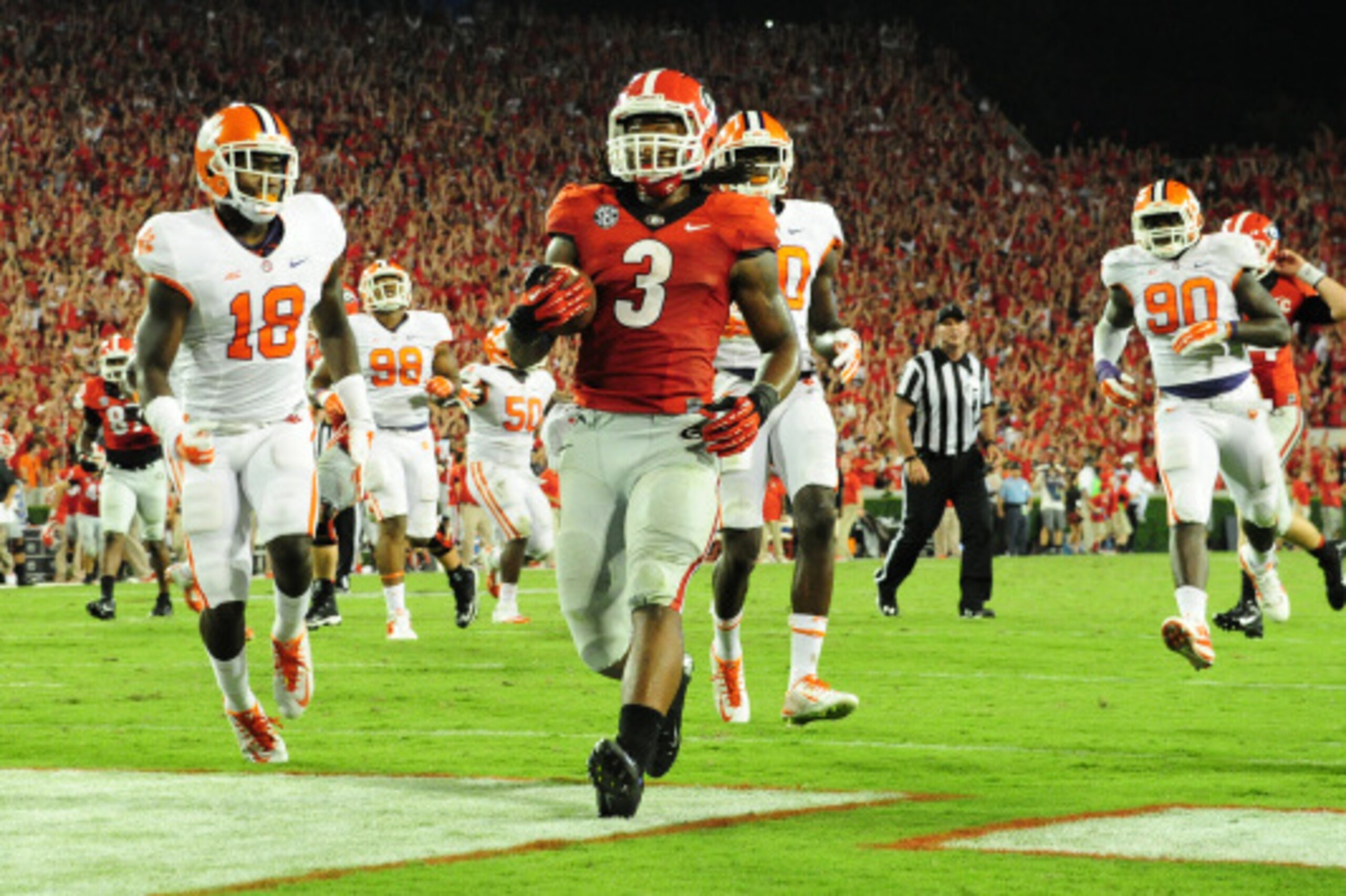 ATHENS, GA - AUGUST 30:  Todd Gurley #3 of the Georgia Bulldogs carries the ball for a fourth-quarter touchdown against the Clemson Tigers at Sanford Stadium on August 30, 2014 in Athens, Georgia. (Photo by Scott Cunningham/Getty Images)
