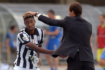 VERONA, ITALY - AUGUST 30:  Head coach  of Juventus Massimiliano Allegri (R) shakes hands with Kingsley Coman during the Serie A match between AC Chievo Verona and Juventus FC at Stadio Marc'Antonio Bentegodi on August 30, 2014 in Verona, Italy.  (Photo b
