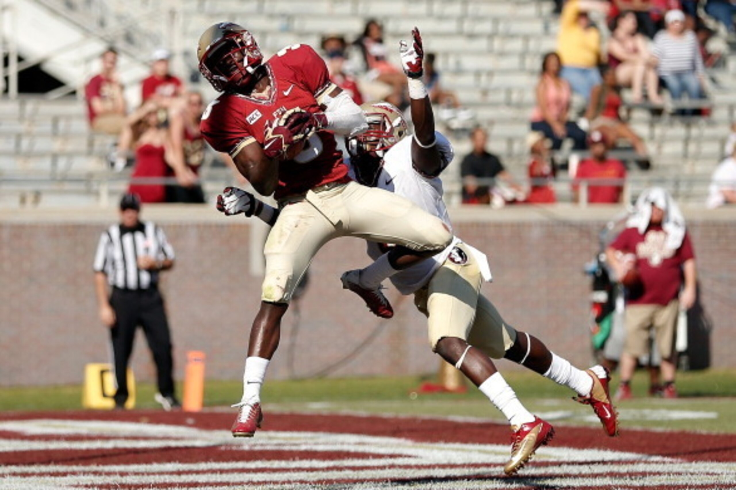 TALLAHASSEE, FL - APRIL 12:  Jesus Wilson #3 of the Garnet team catches a touchdown pass in front of Nick Waisome #6 of the Gold team during Florida State's Garnet and Gold spring game at Doak Campbell Stadium on April 12, 2014 in Tallahassee, Florida.  (