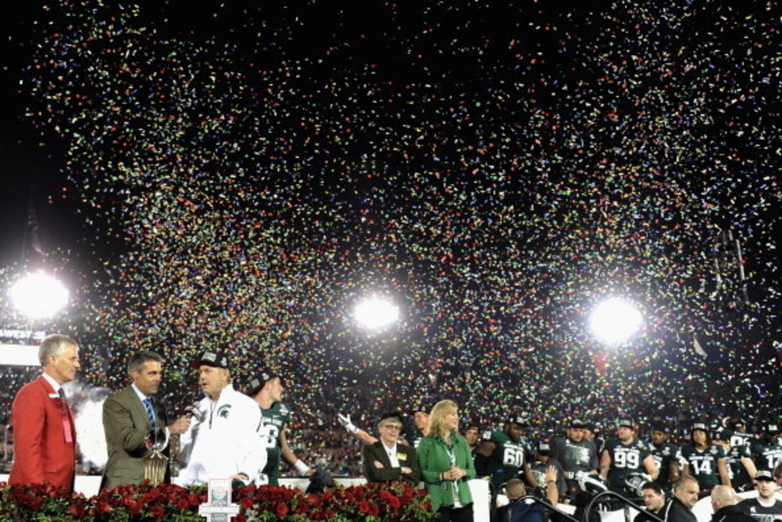 PASADENA, CA - JANUARY 01:  (3rd-L) Michigan State Spartans head coach Mark Dantonio is interviewed onstage after defeating the Stanford Cardinal 24-20 in the 100th Rose Bowl Game presented by Vizio at the Rose Bowl on January 1, 2014 in Pasadena, Califor
