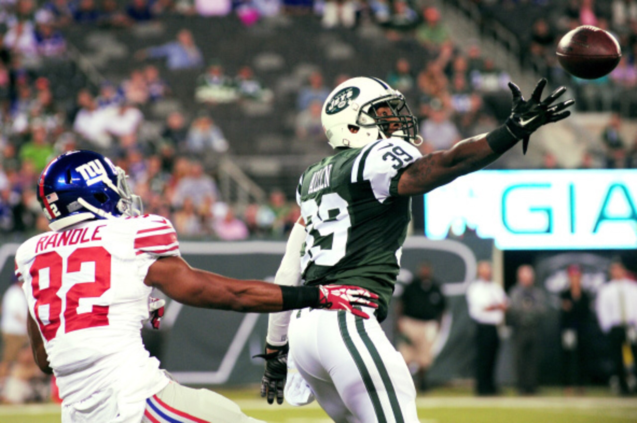 EAST RUTHERFORD, NJ - AUGUST 22:  Antonio Allen #39 of the New York Jets breaks up a pass inteded for Rueben Randle #82 of the New York Giants during the first quarter of a preseason game at MetLife Stadium on August 22, 2014 in East Rutherford, New Jerse