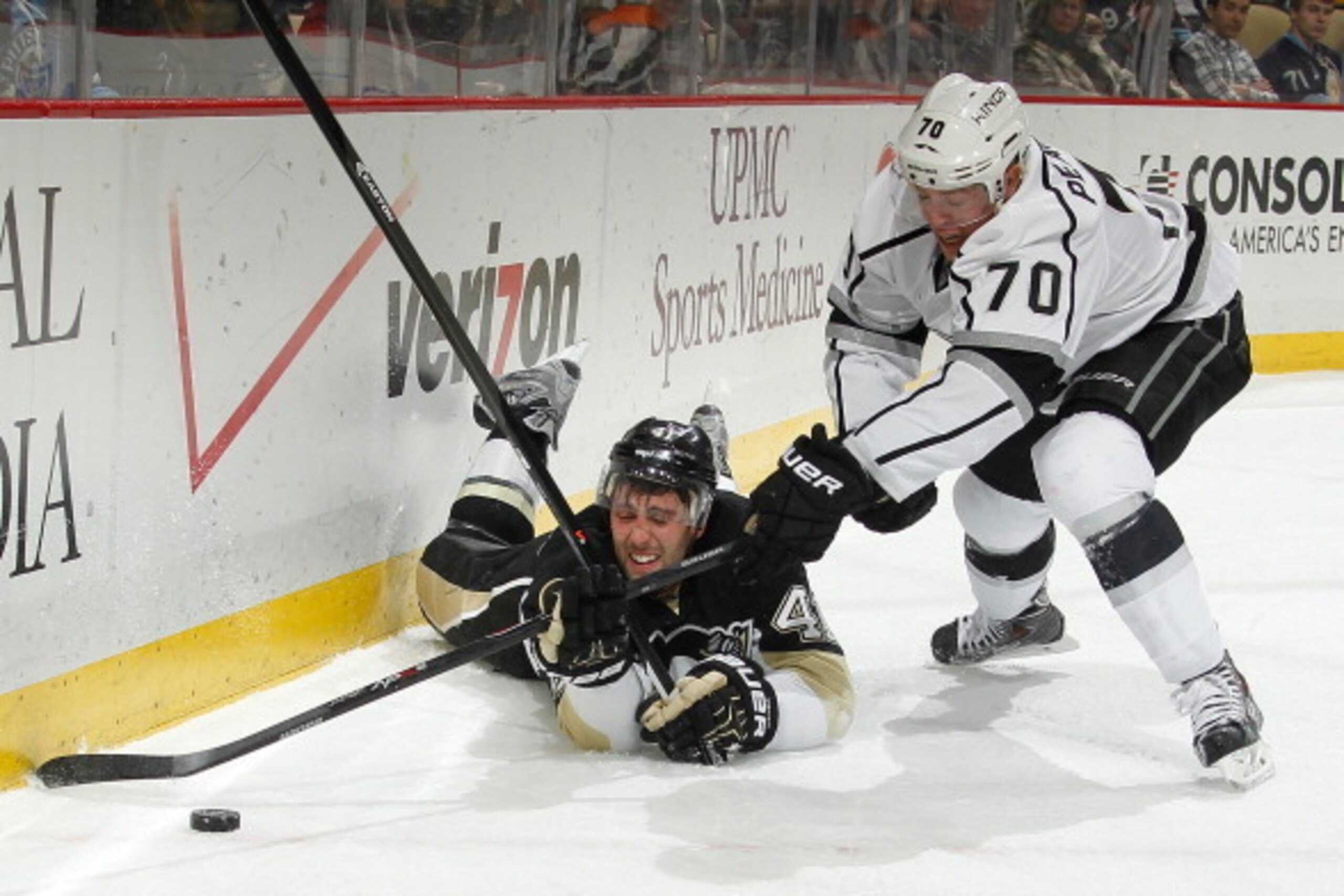 PITTSBURGH, PA - MARCH 27: Robert Bortuzzo #41 of the Pittsburgh Penguins dives for the loose puck against Tanner Pearson #70 of the Los Angeles Kings on March 27, 2014 at Consol Energy Center in Pittsburgh, Pennsylvania. (Photo by Gregory Shamus/NHLI v PITTSBURGH, PA - MARCH 27: Robert Bortuzzo #41 of the Pittsburgh Penguins dives for the loose puck against Tanner Pearson #70 of the Los Angeles Kings on March 27, 2014 at Consol Energy Center in Pittsburgh, Pennsylvania. (Photo by Gregory Shamus/NHLI v
