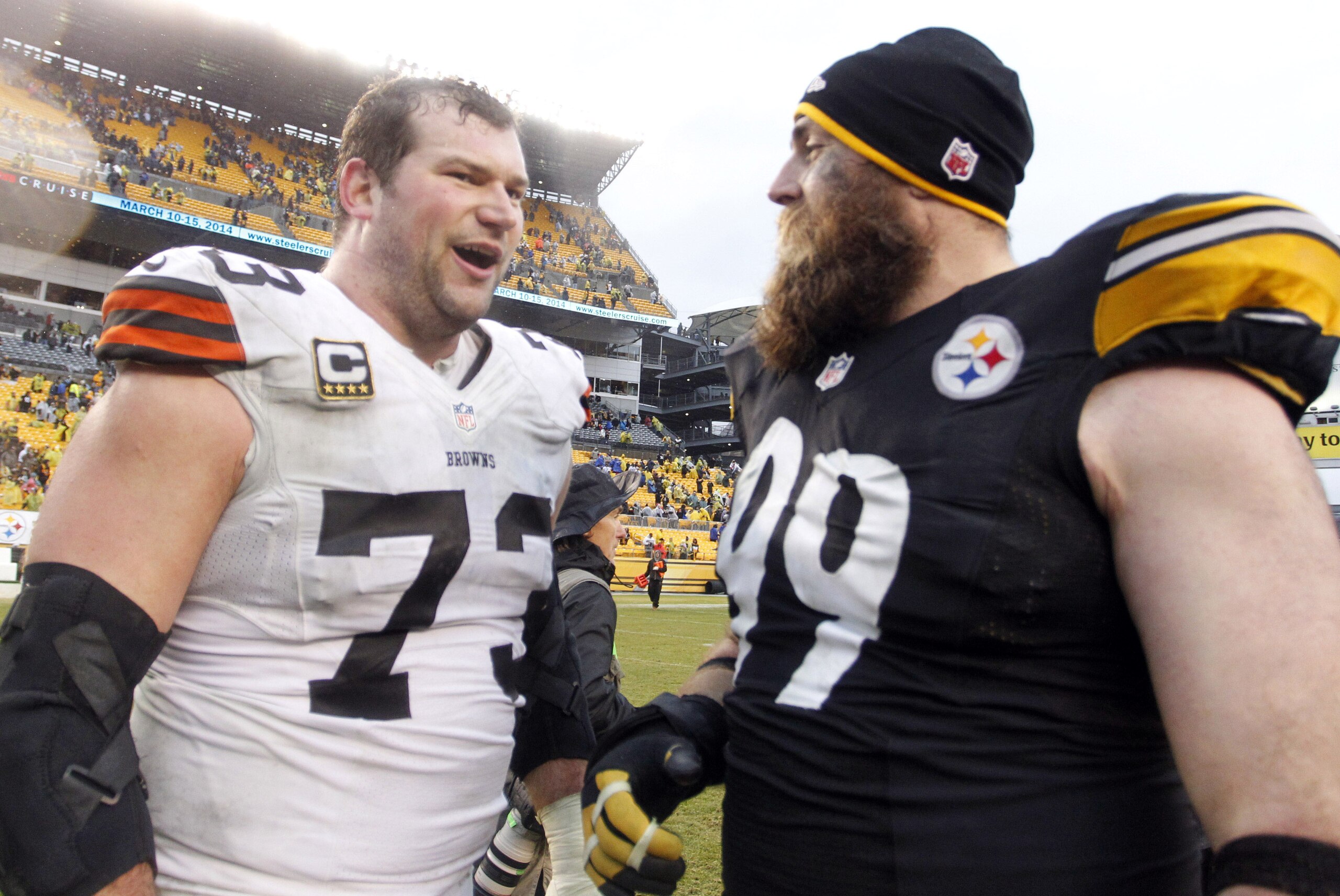 Dec 29, 2013; Pittsburgh, PA, USA; Cleveland Browns tackle Joe Thomas (73) and Pittsburgh Steelers defensive end Brett Keisel (99) meet at mid-field after playing at Heinz Field. The Pittsburgh Steelers won 20-7. Mandatory Credit: Charles LeClaire-USA TOD