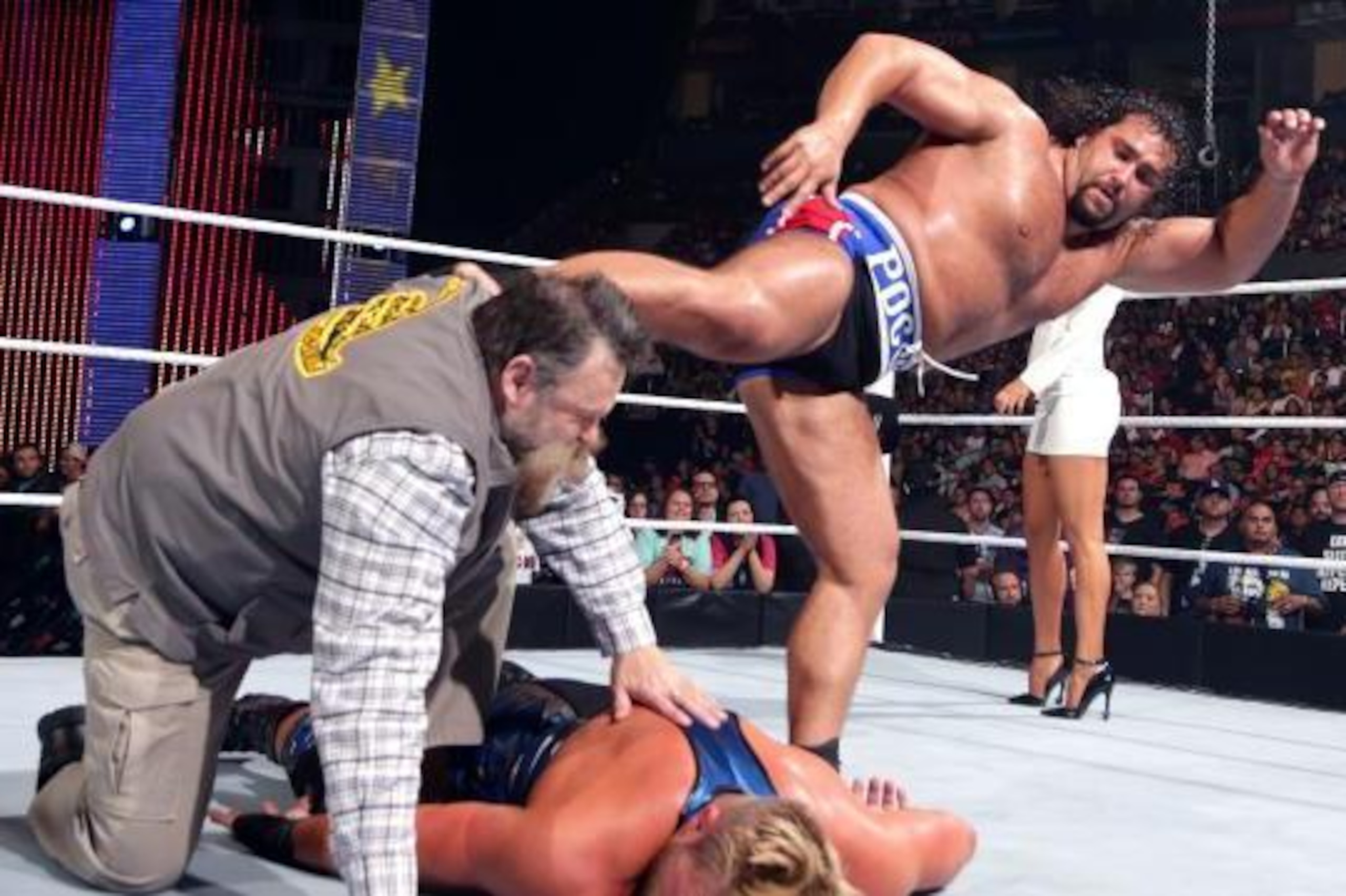 Rusev kicks Zeb Colter at SummerSlam.