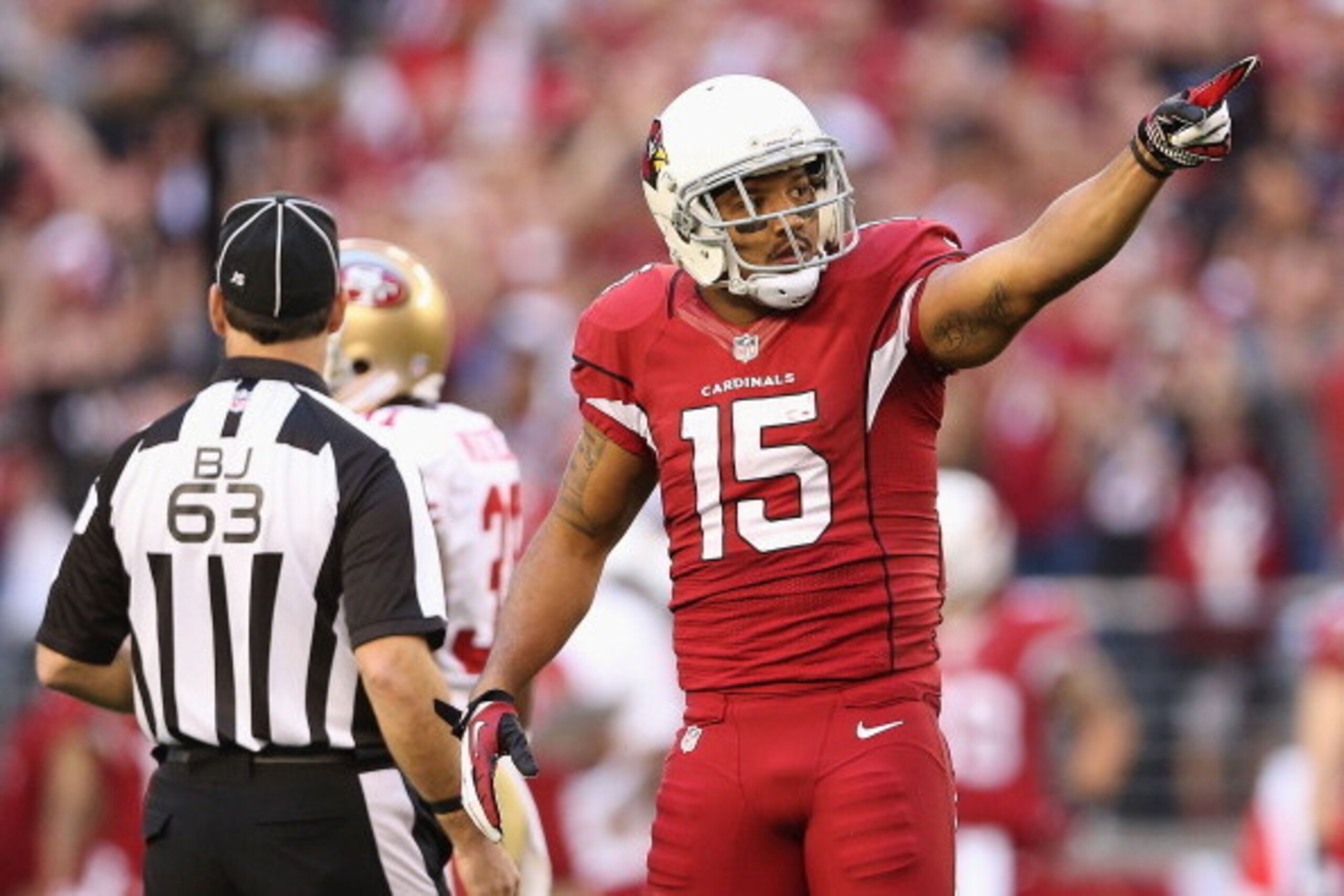 GLENDALE, AZ - DECEMBER 29:  Wide receiver Michael Floyd #15 of the Arizona Cardinals after a reception against the San Francisco 49ers during the NFL game at the University of Phoenix Stadium on December 29, 2013 in Glendale, Arizona.  The 49ers defeated