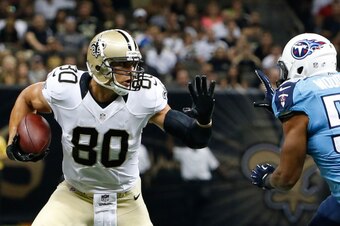 NEW ORLEANS, LA - AUGUST 15:  Jimmy Graham #80 of the New Orleans Saints runs against Wesley Woodyard #59 of the Tennessee Titans during a preseason game at Mercedes-Benz Superdome on August 15, 2014 in New Orleans, Louisiana.  (Photo by Stacy Revere/Gett