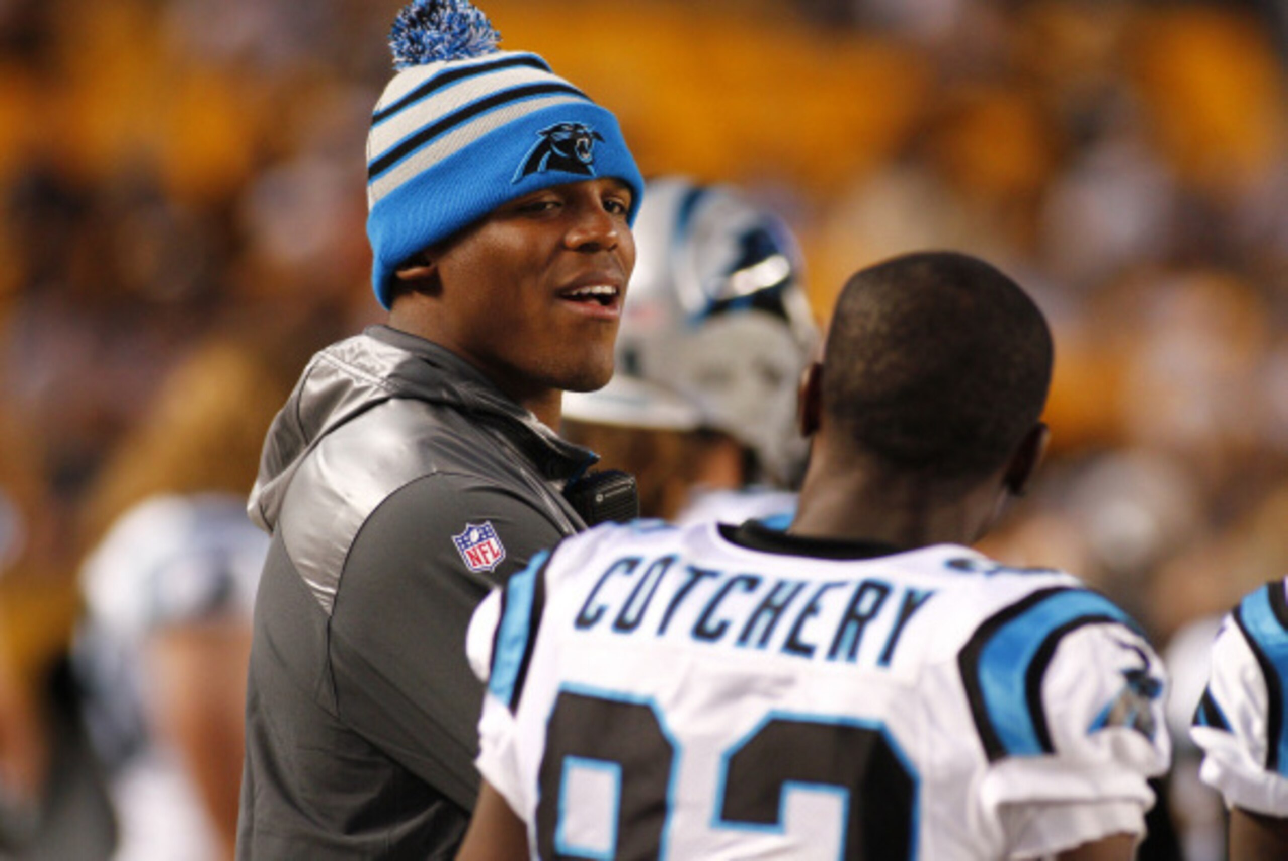 PITTSBURGH, PA - AUGUST 28: Cam Newton #1 of the Carolina Panthers talks to Jerricho Cotchery #82 on the sideline during the first quarter of a game against the Pittsburgh Steelers at Heinz Field on August 28, 2014 in Pittsburgh, Pennsylvania. (Photo by J