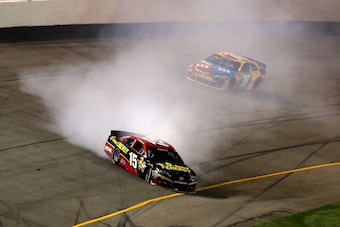 RICHMOND, VA - SEPTEMBER 07:  Clint Bowyer, driver of the #15 5-hour ENERGY Toyota, spins in front of Kyle Busch, driver of the #18 M&M's American Heritage Chocolate Toyota, during the NASCAR Sprint Cup Series 56th Annual Federated Auto Parts 400 at Richm