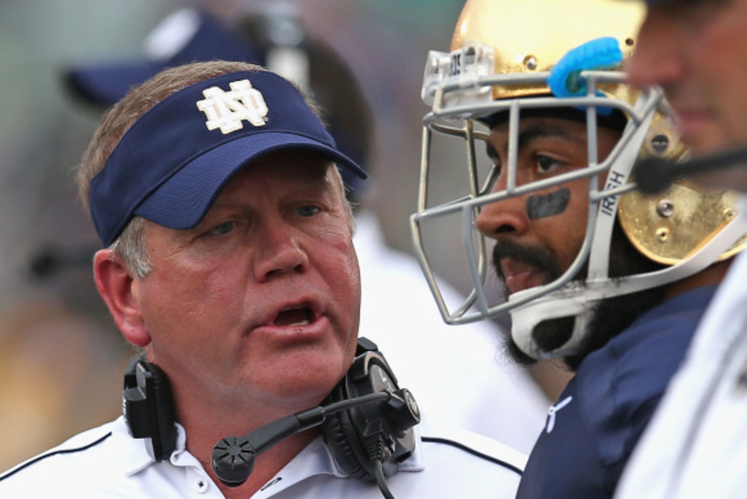 SOUTH BEND, IN - AUGUST 30:  Head coach Brian Kelly of the Notre Dame Fighting Irish talks to Matthias Farley #41 against the Rice Owls at Notre Dame Stadium on August 30, 2014 in South Bend, Indiana. Notre Dame defeated Rice 48-17.  (Photo by Jonathan Da