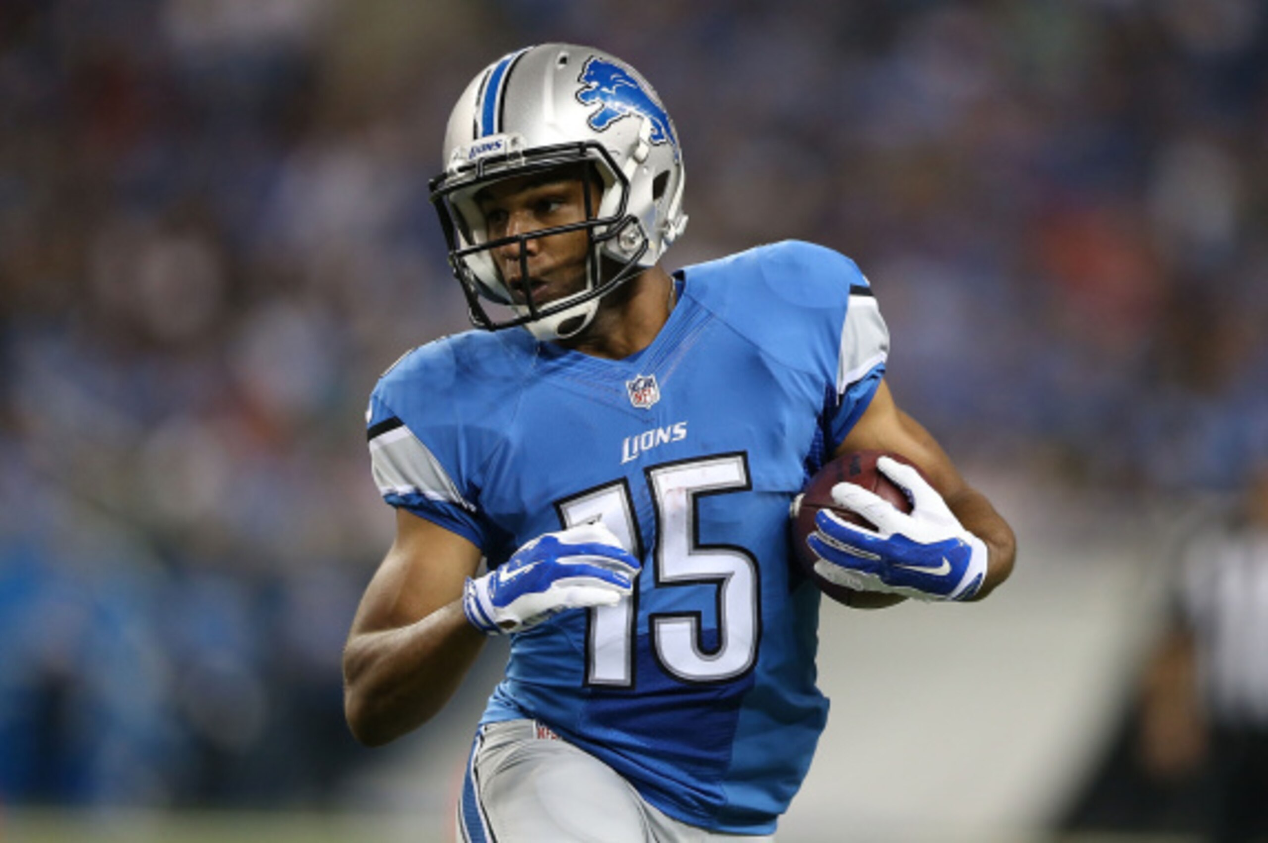 DETROIT, MI - AUGUST 22:  Golden Tate #15 of the Detroit Lions runs for a short gain during the first half of the preseason game against the Jacksonville Jaguars at Ford Field on August 22, 2014 in Detroit, Michigan. The Lions defeated the Jaguars 13-12. 