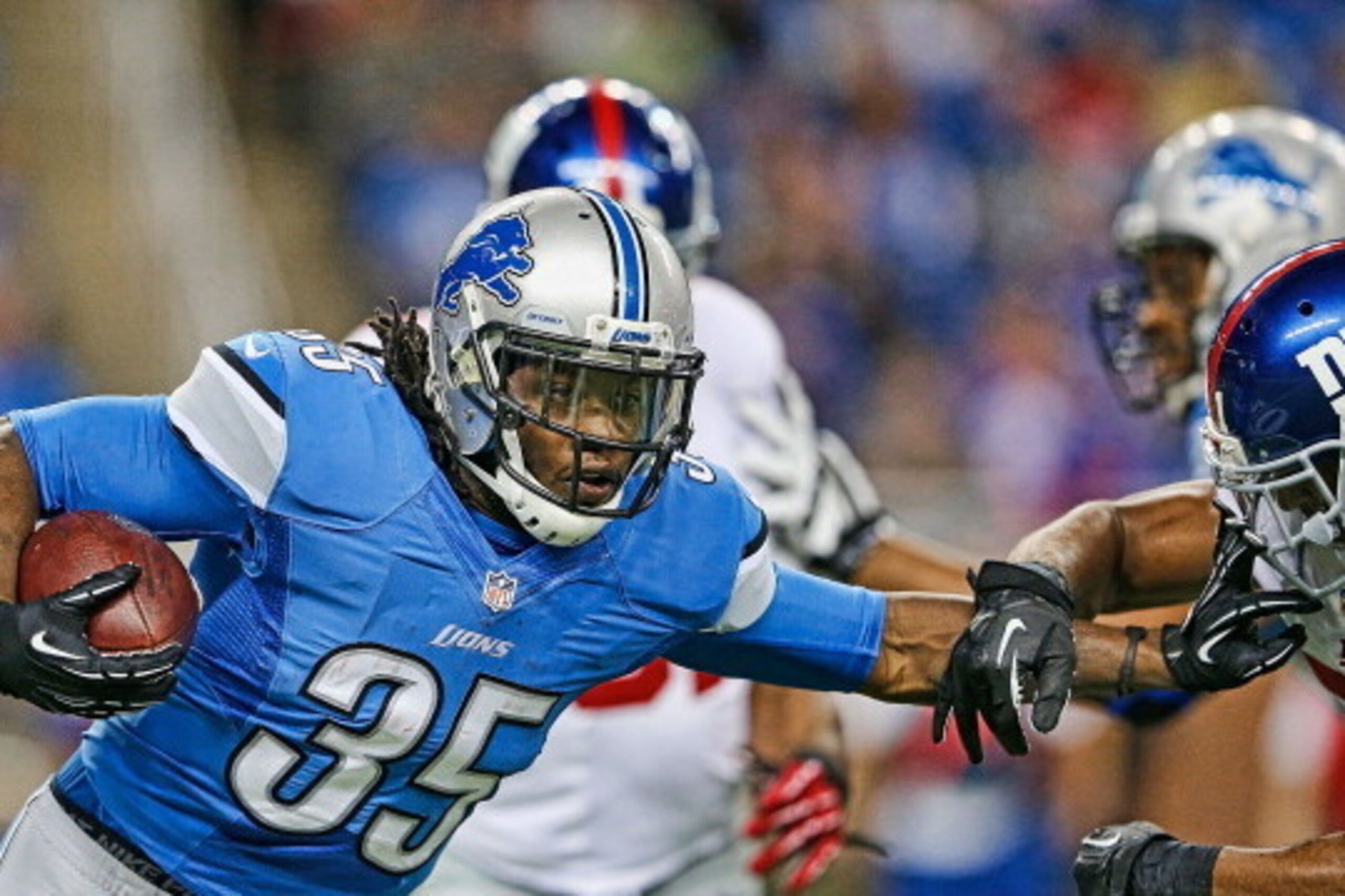 DETROIT, MI - DECEMBER 22: Joique Bell #35 of the Detroit Lions runs for a short gain during the second quarter of the game against the New York Giants at Ford Field on December 22, 2013 in Detroit, Michigan.  (Photo by Leon Halip/Getty Images)