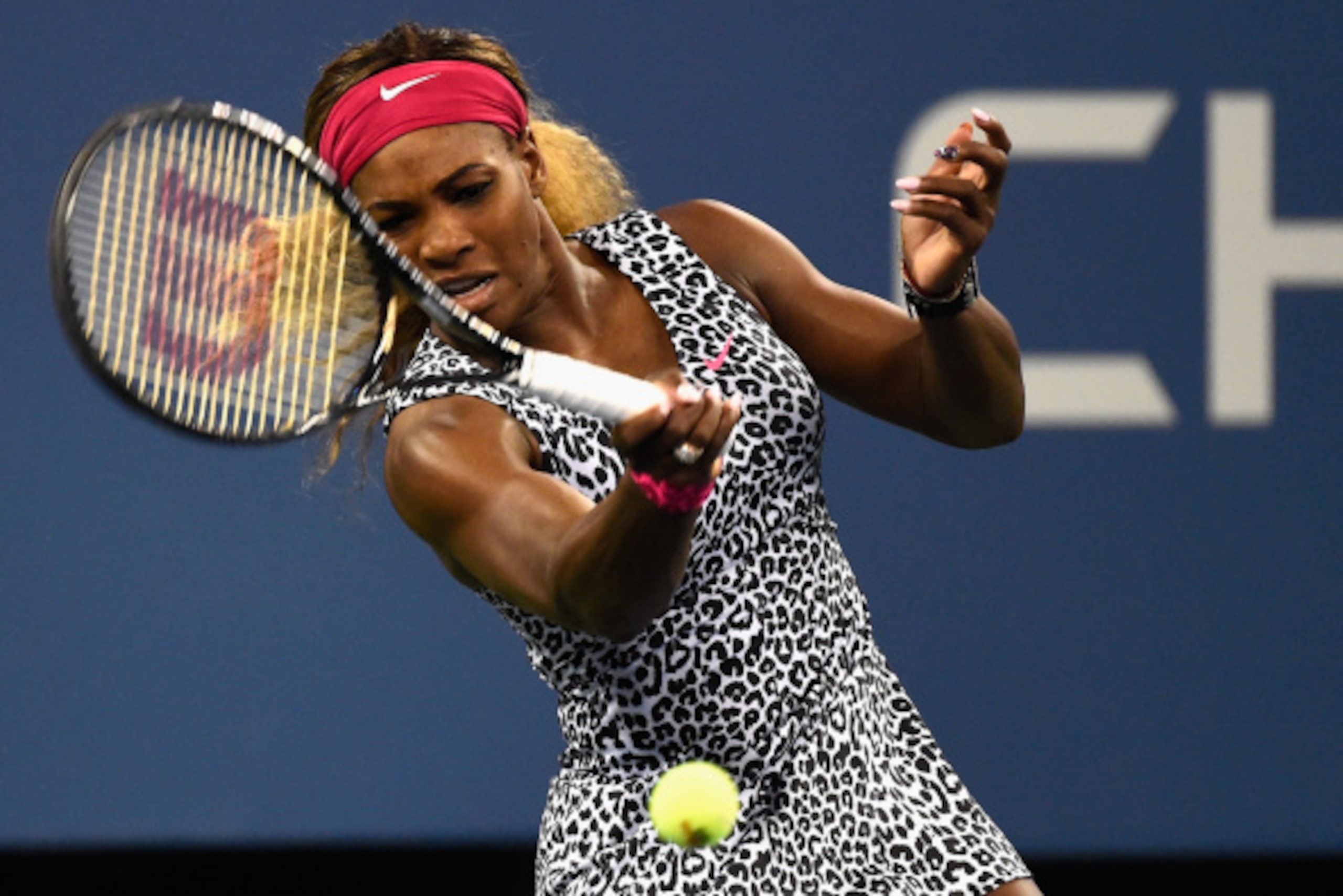 NEW YORK, NY - SEPTEMBER 03:  Serena Williams of the United States returns a shot against Flavia Pennetta of Italy during their women's singles quarterfinal match on Day Ten of the 2014 US Open at the USTA Billie Jean King National Tennis Center on Septem